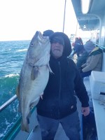 a person holding a fish