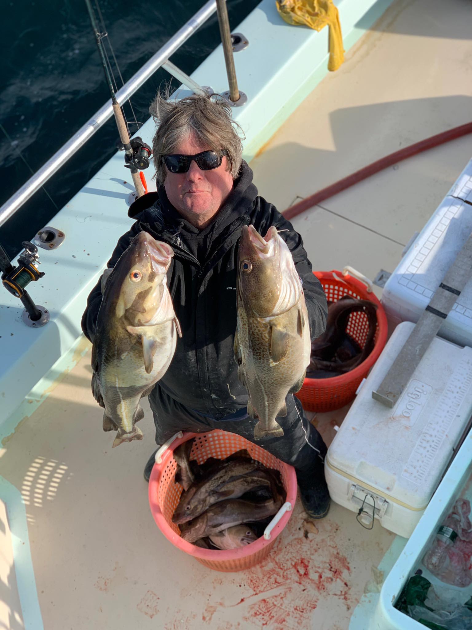 a man holding a fish