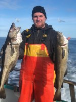 a man holding a fish