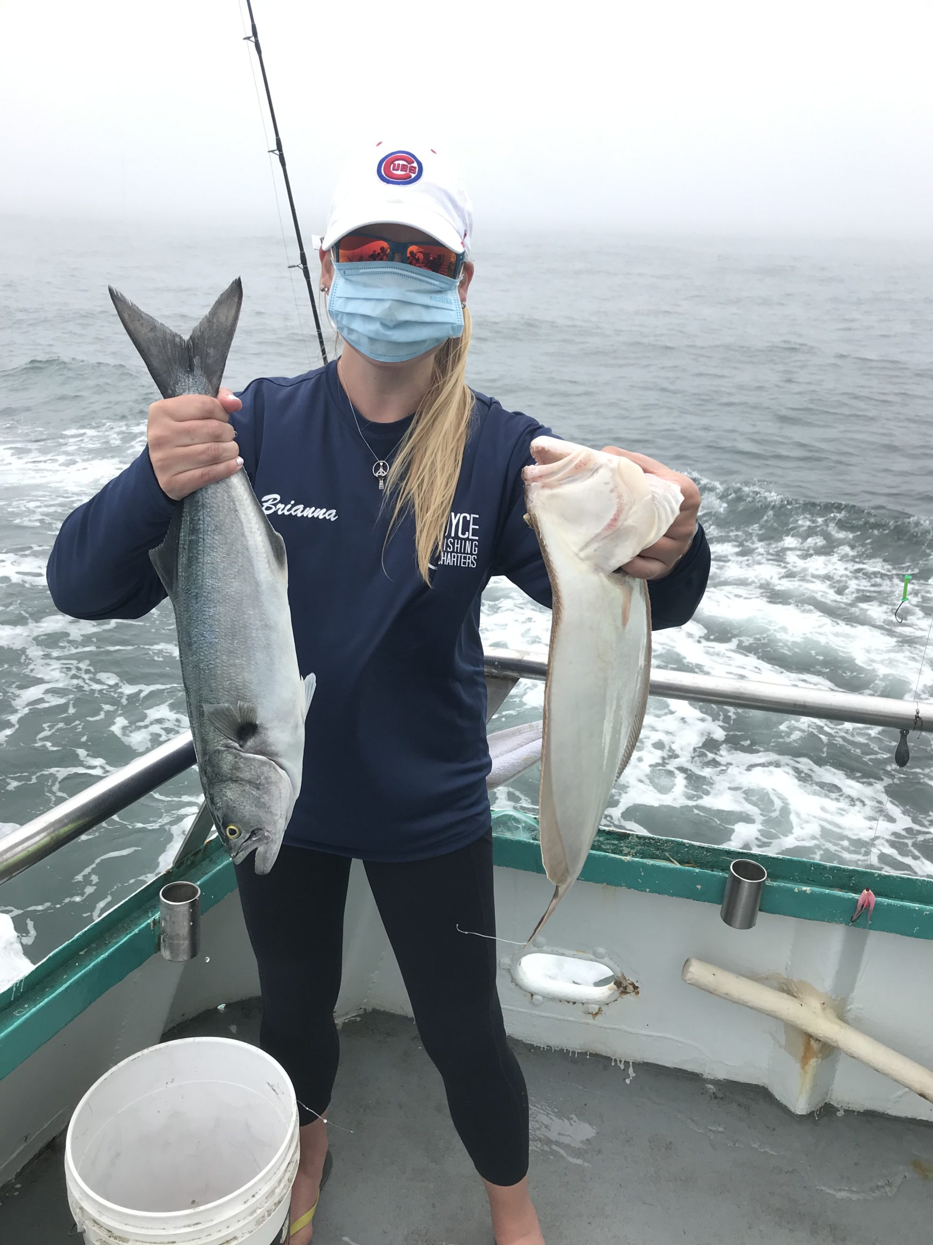 a person holding a fish in the water
