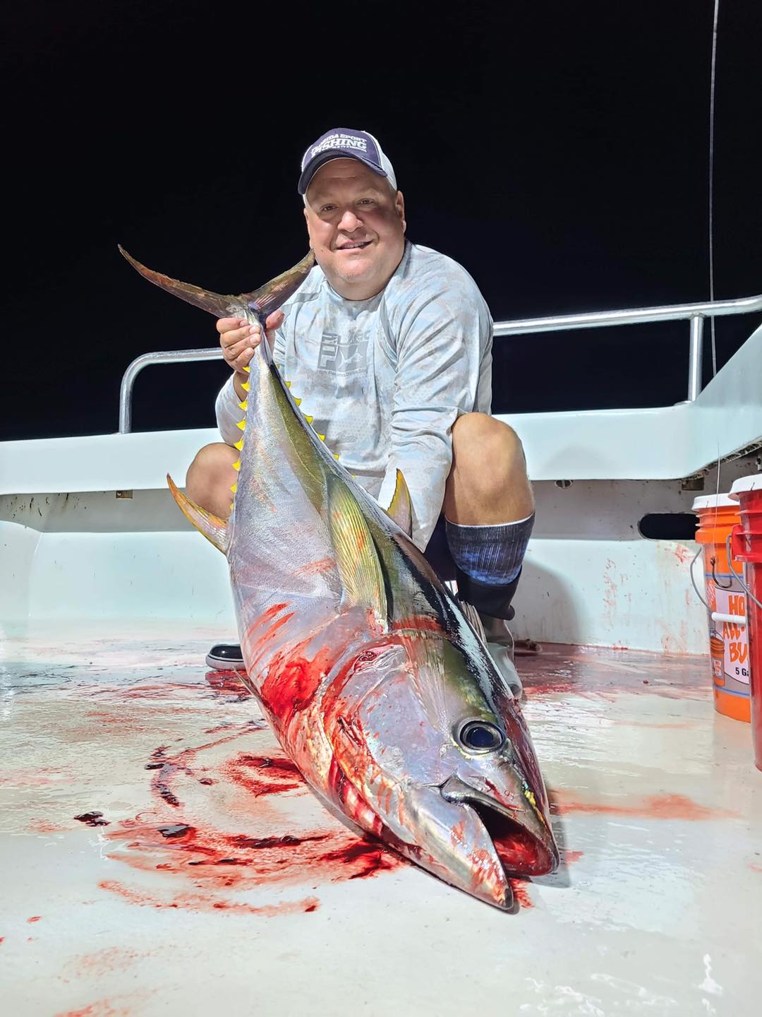 a man holding a fish