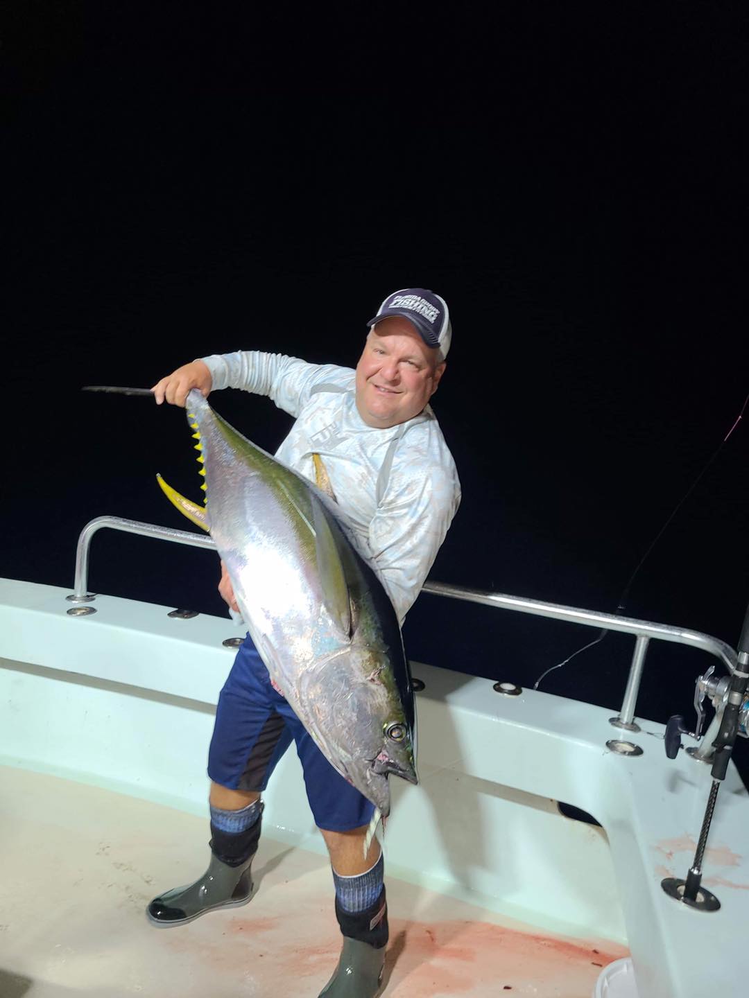 a man holding a fish
