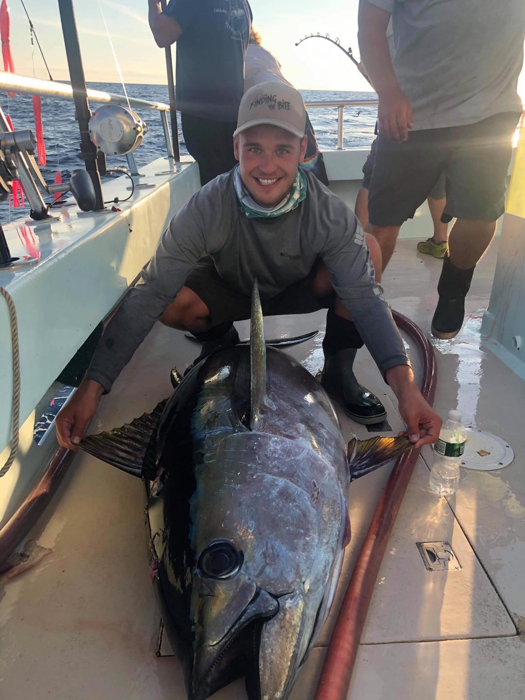 a man holding a fish