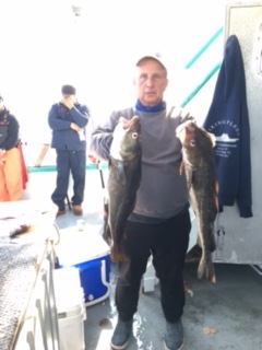 a man holding a fish