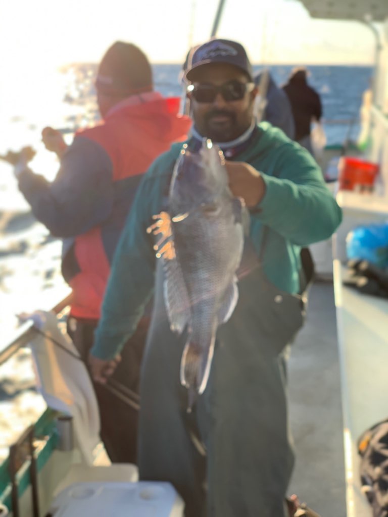 a person holding a fish