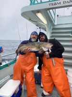 a man holding a fish
