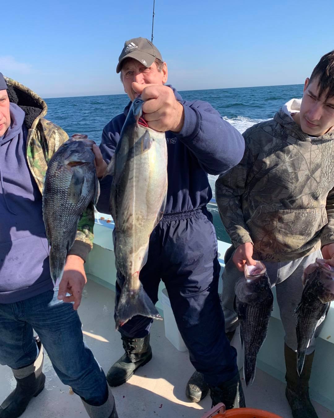a person holding a fish in the water