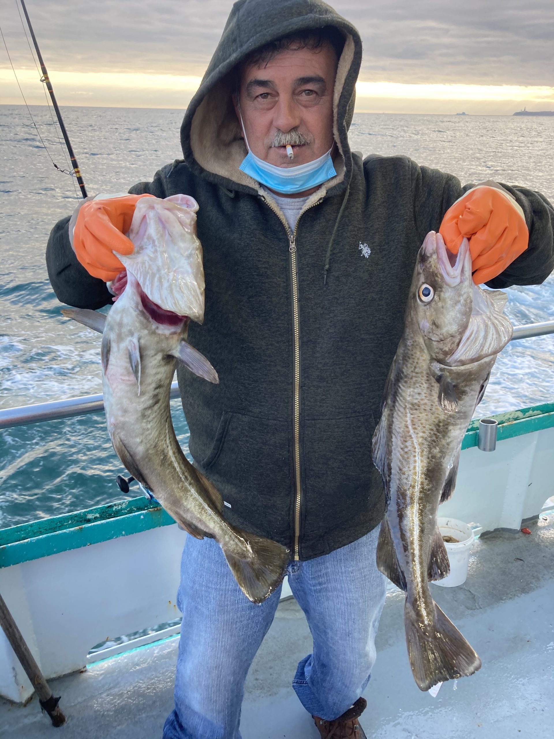 a person holding a fish in the water
