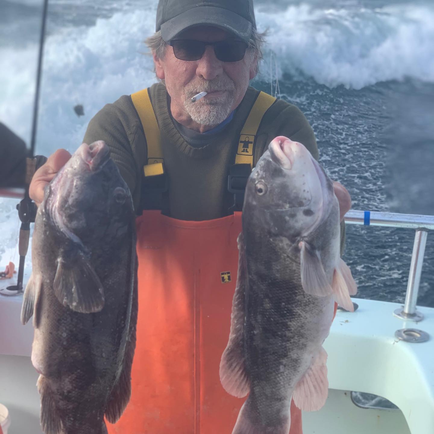 a man holding a fish