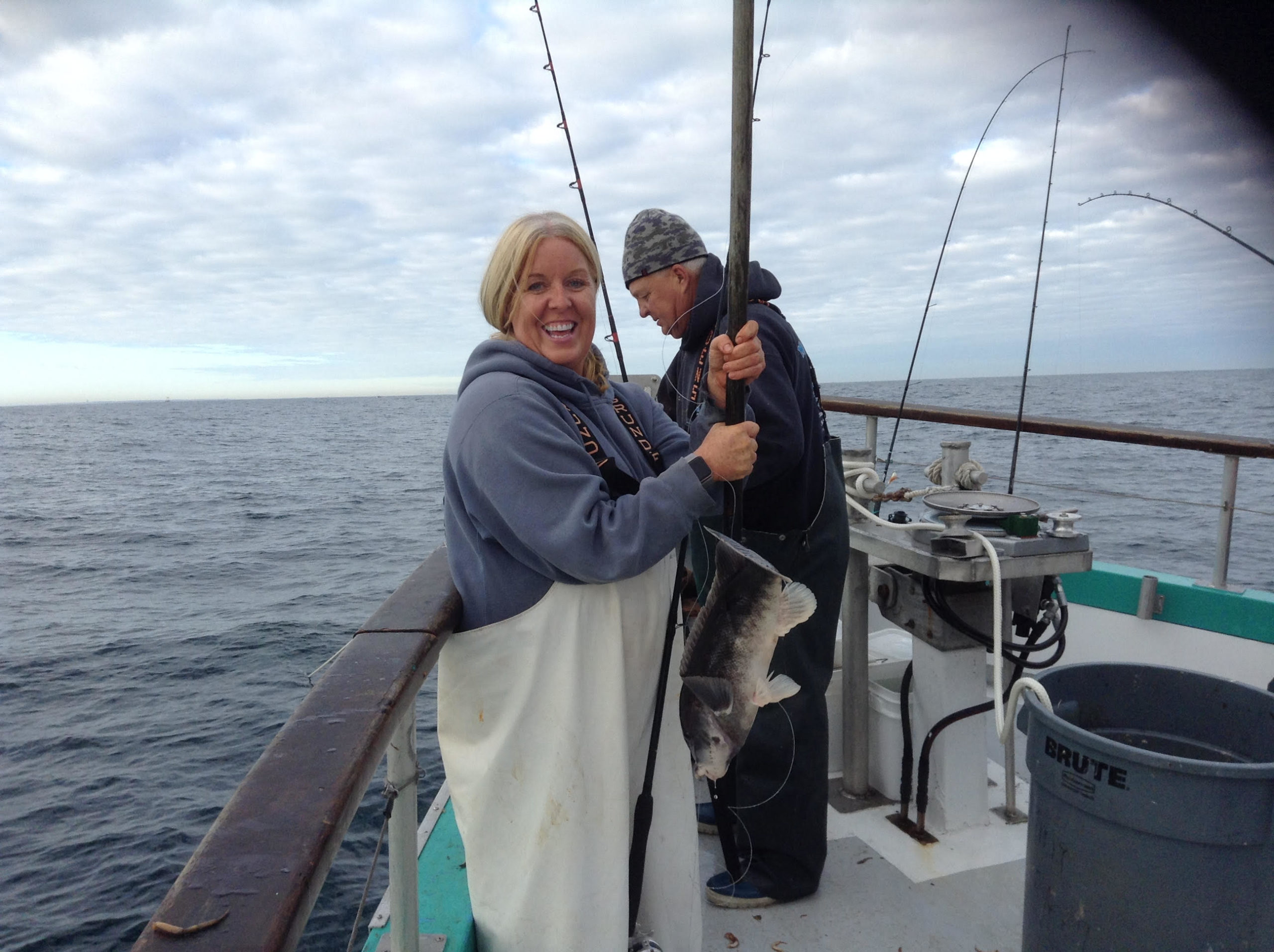 a person standing next to a body of water