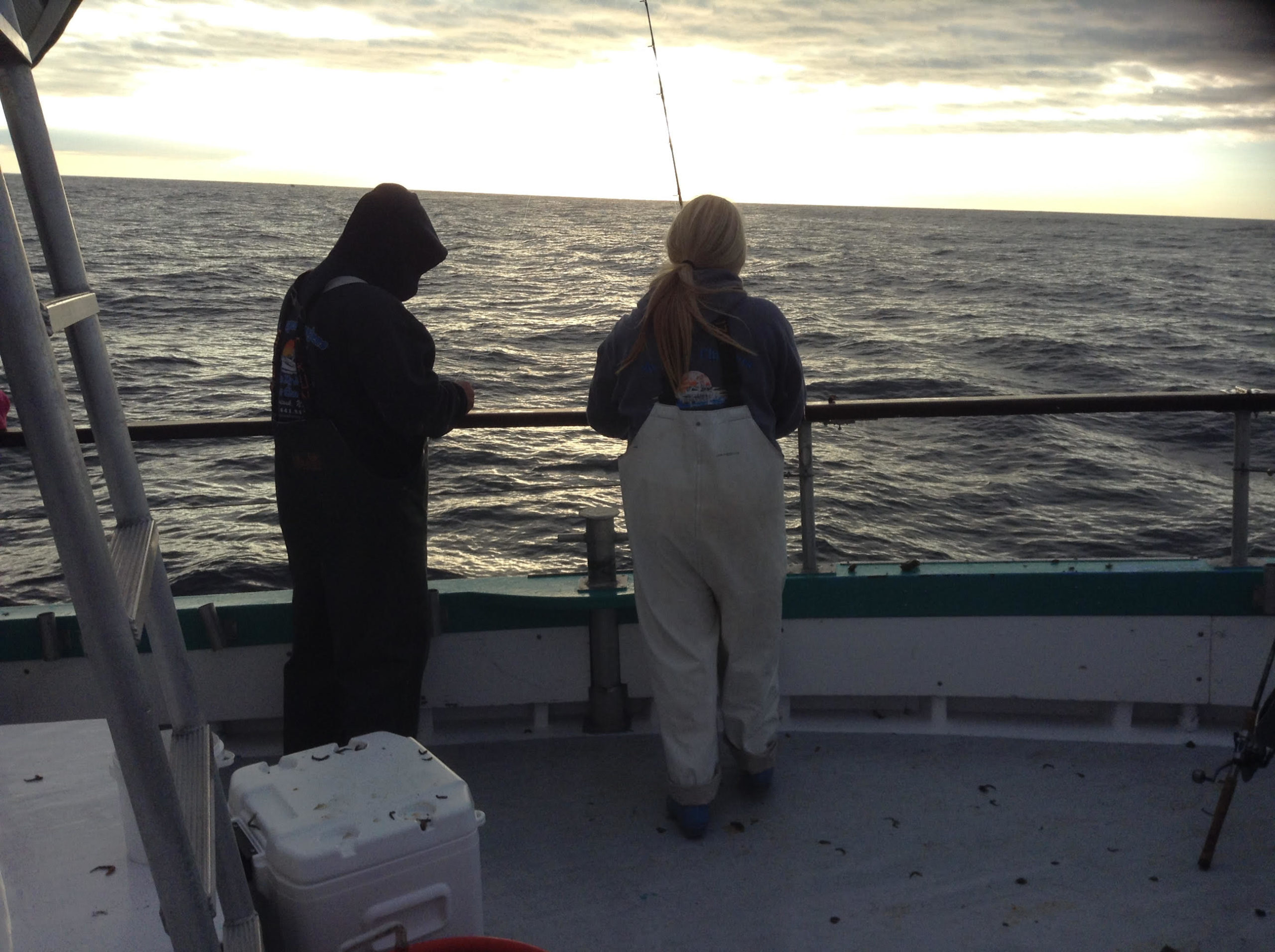 a person standing next to a body of water