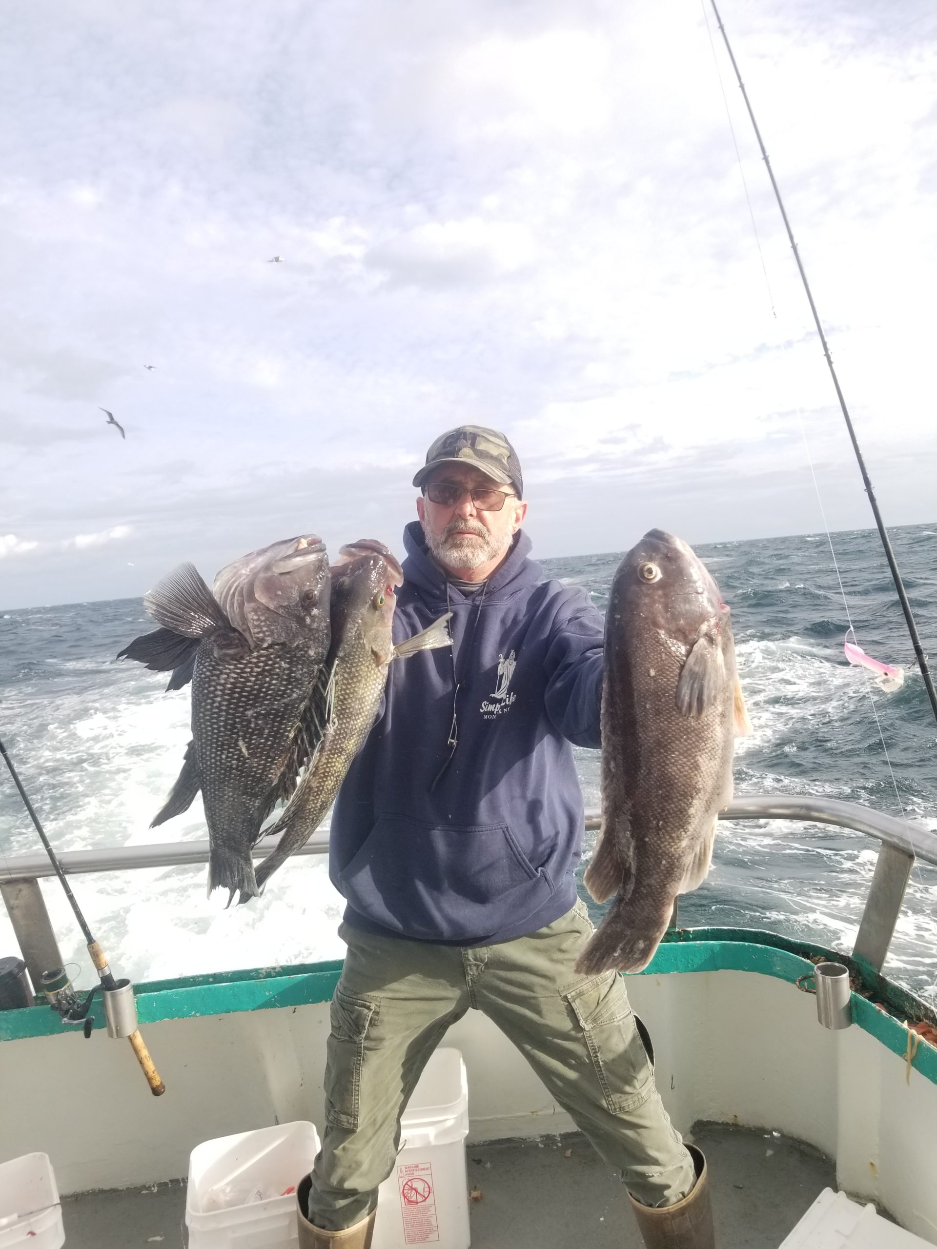 a man holding a fish in the water