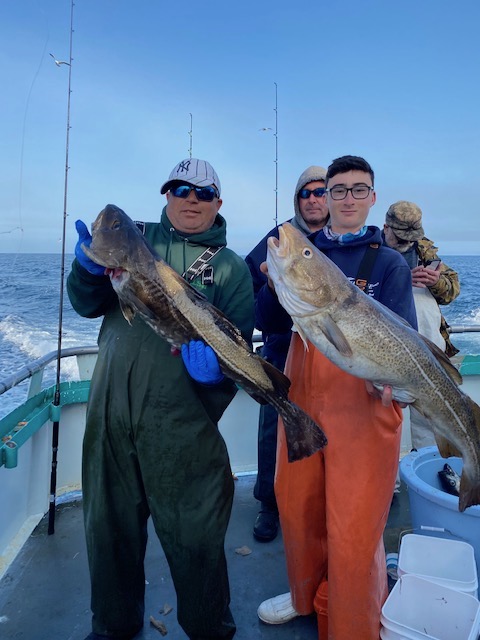 a person holding a fish