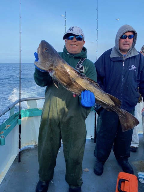 a man holding a fish