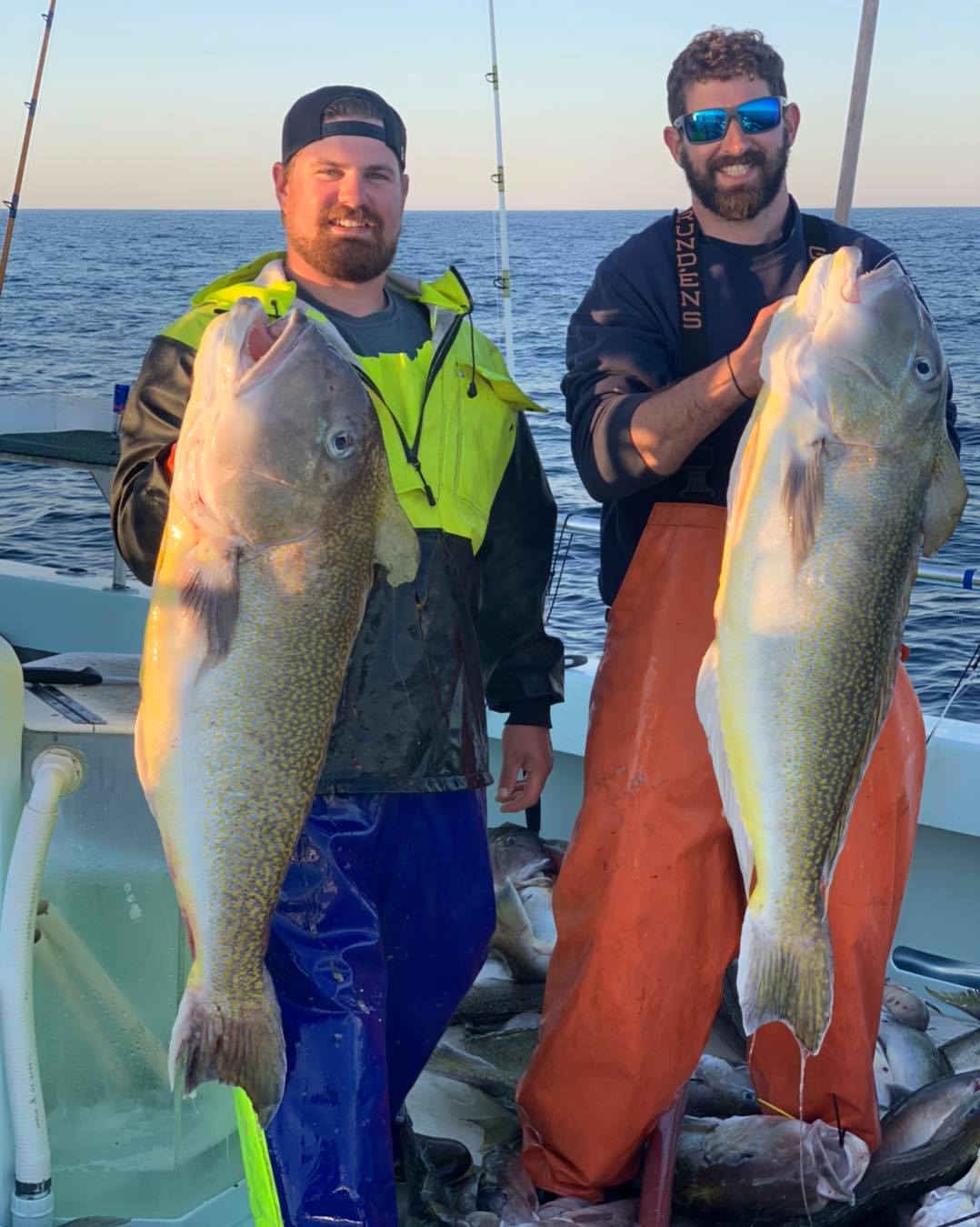 a man holding a fish in the water