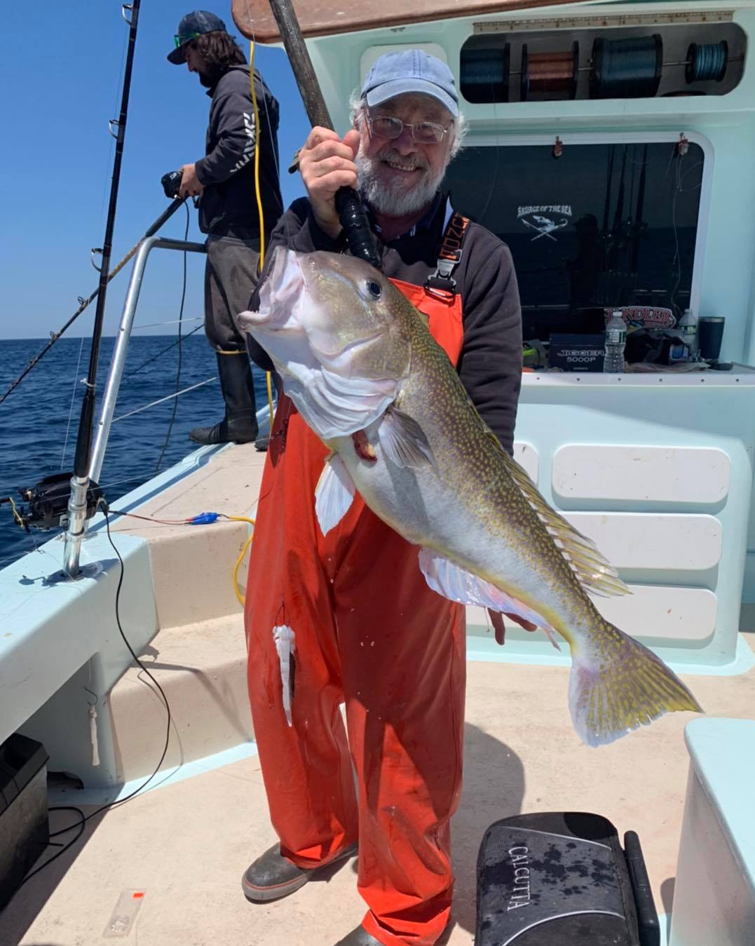 a man holding a fish