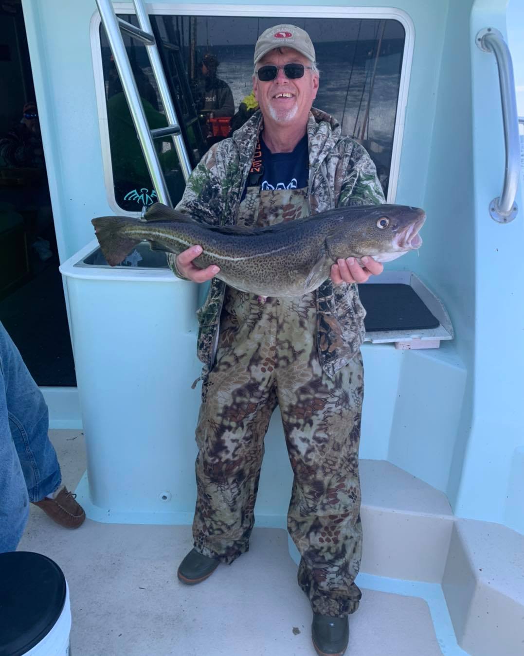 a man holding a fish