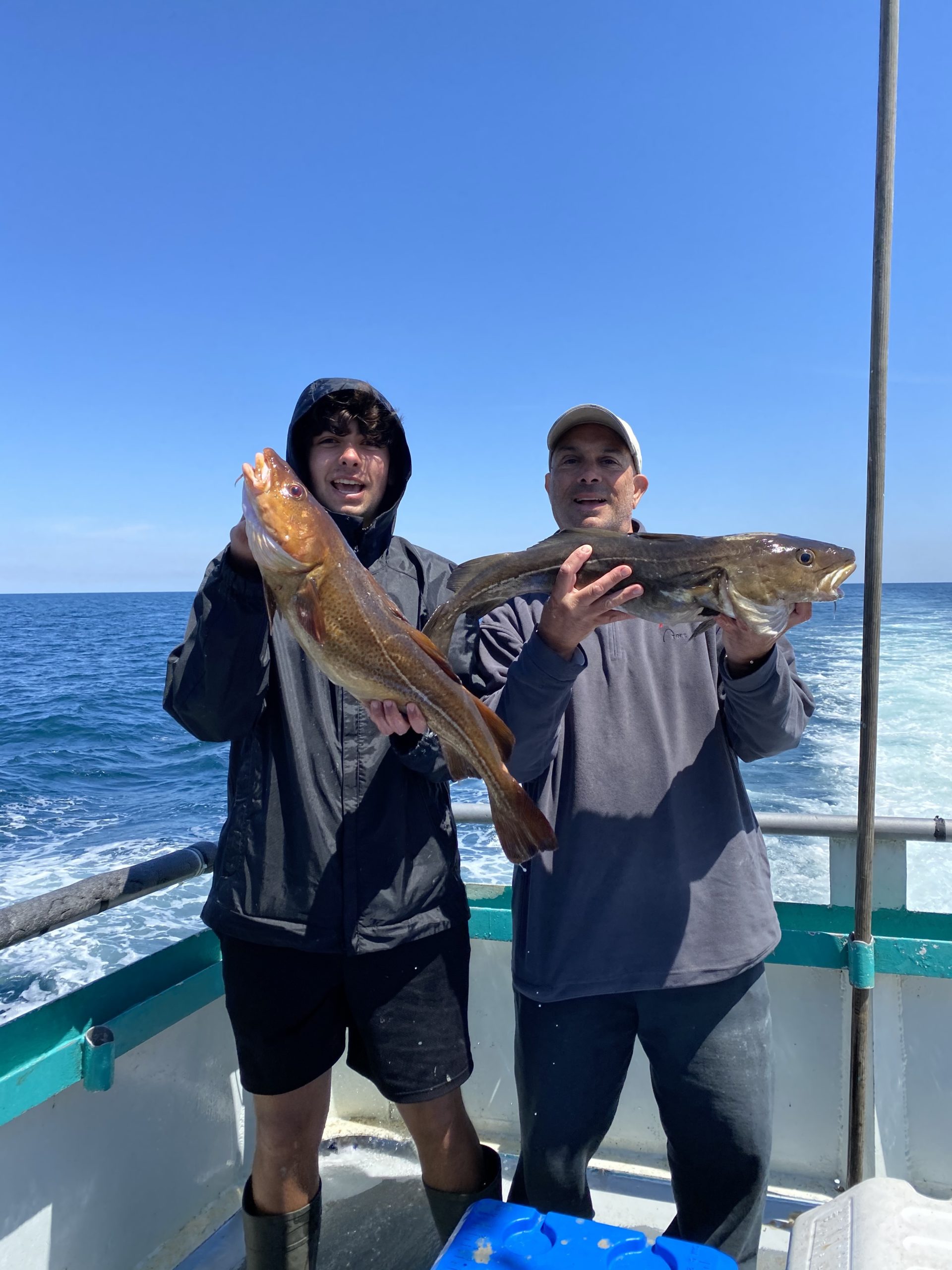 a person holding a fish in the water