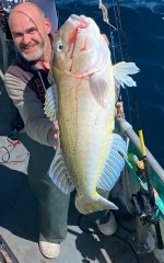 a person holding a fish