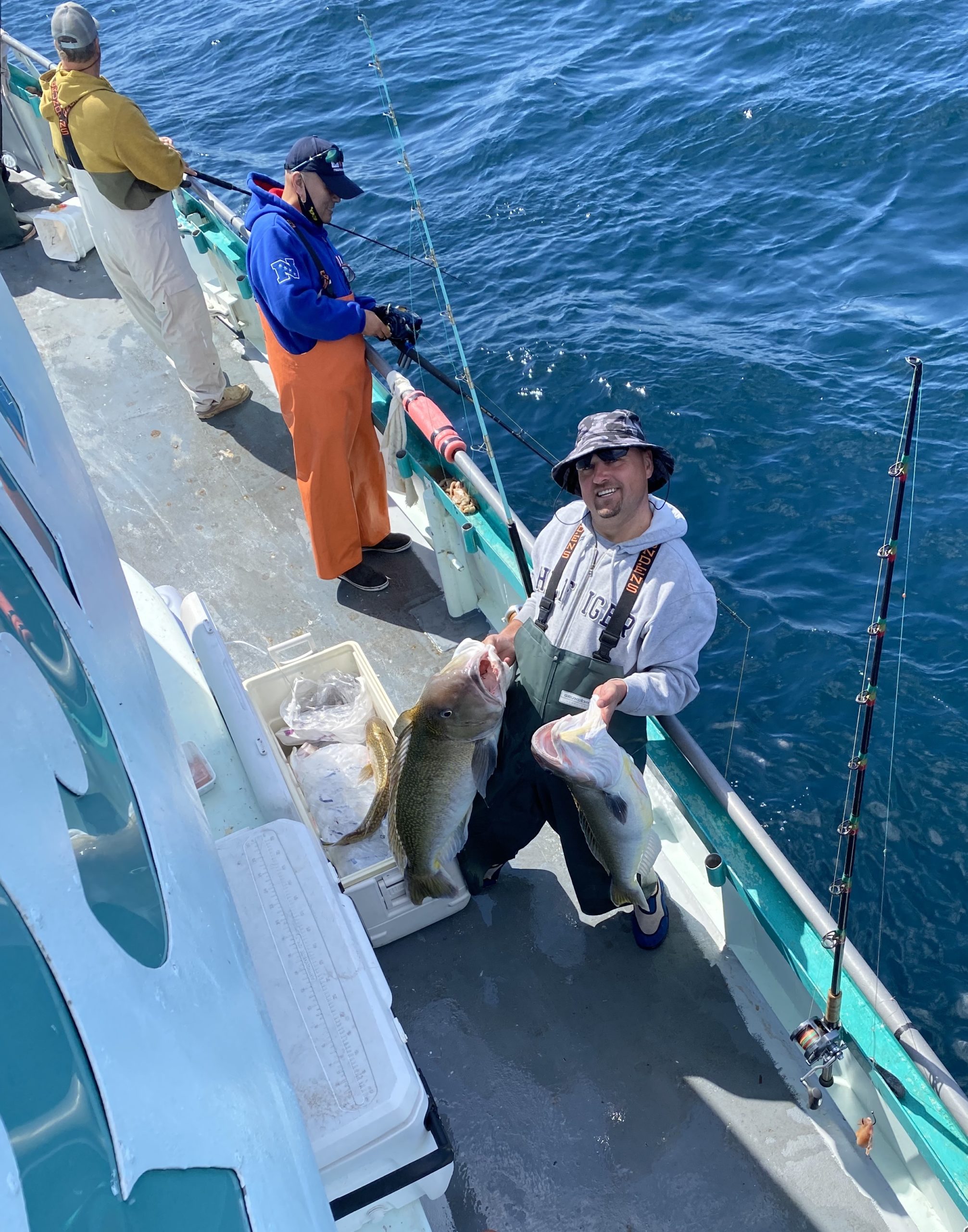 a group of people walking down a fish in the water