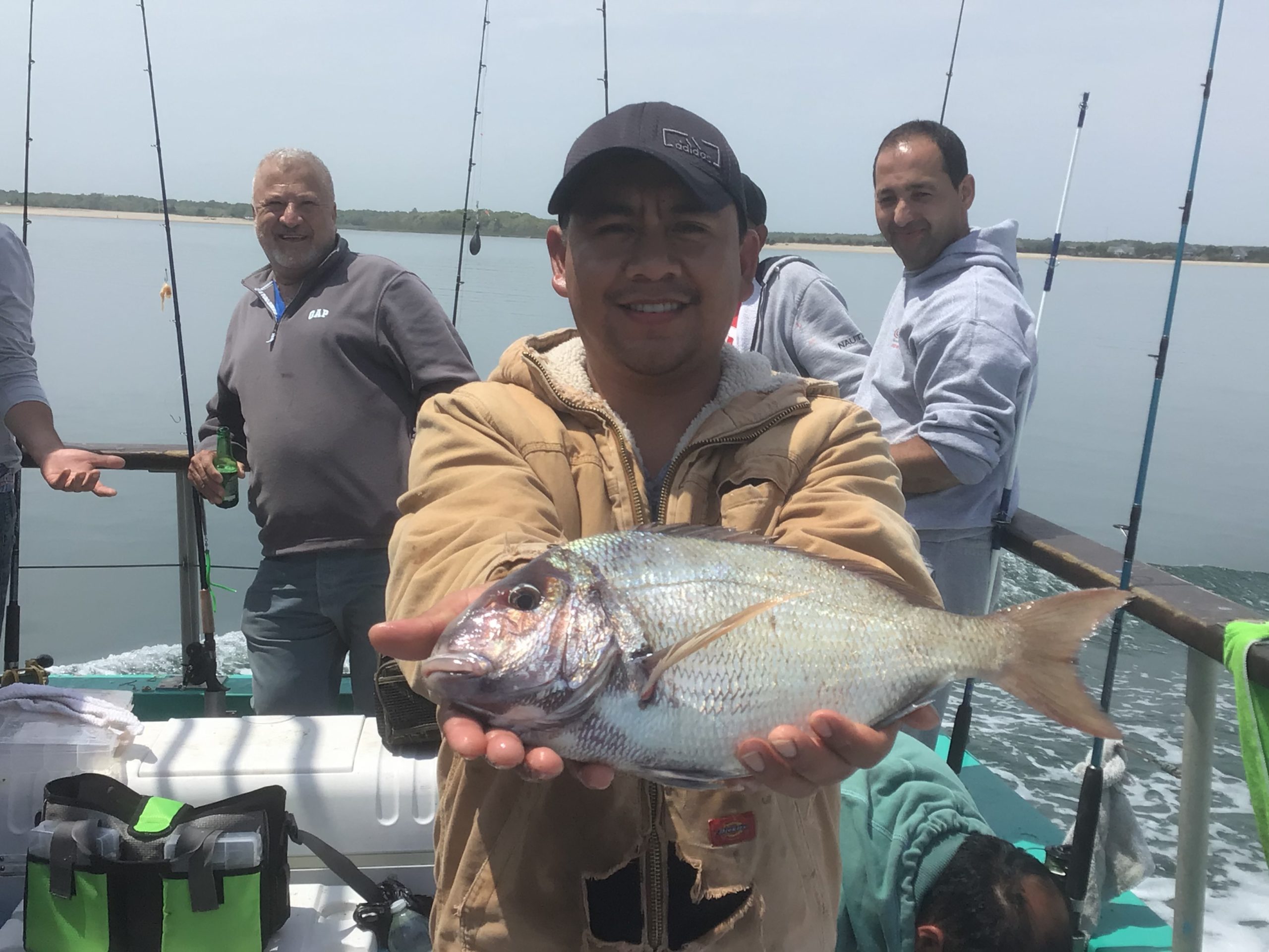 a person holding a fish