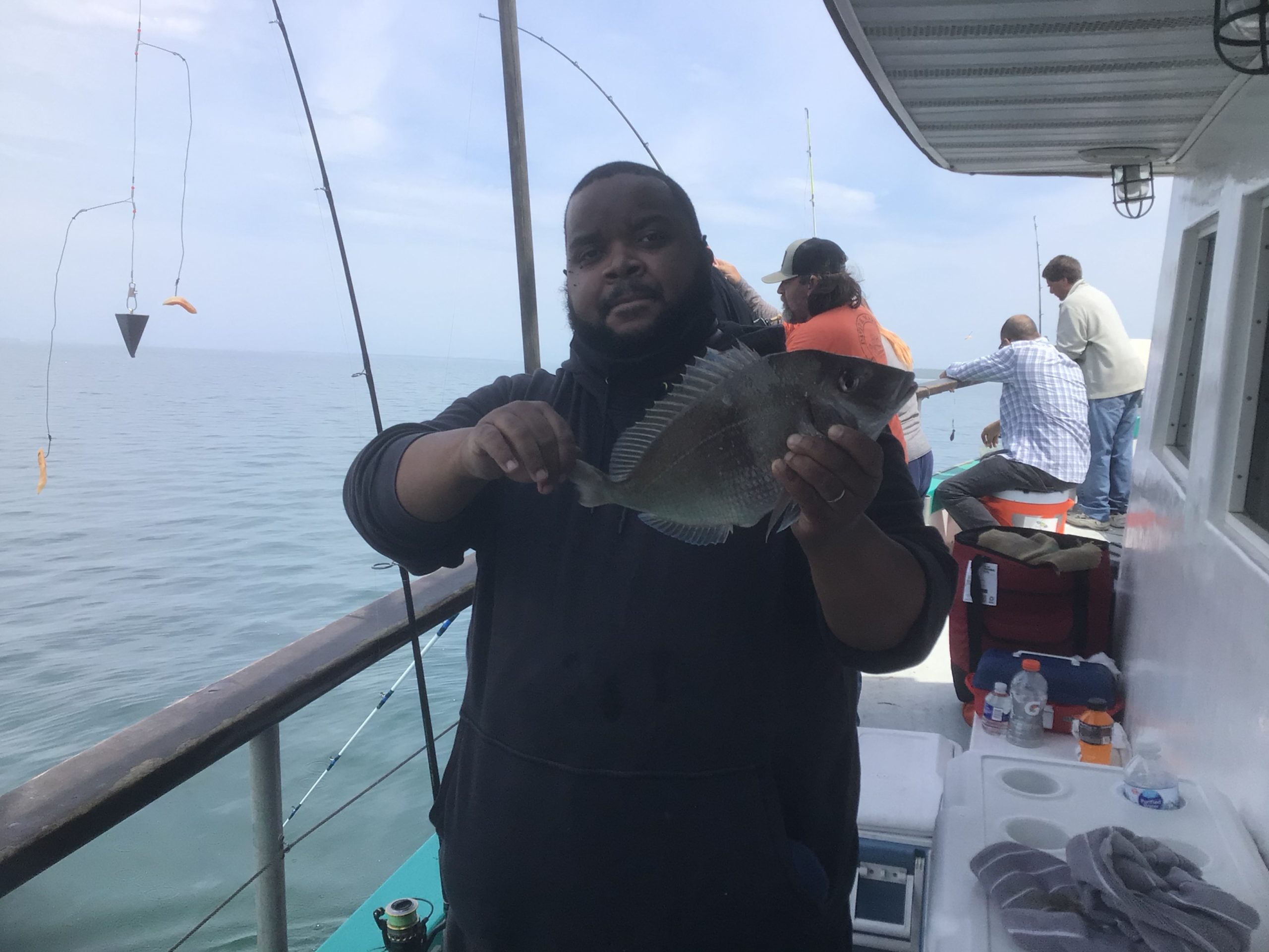 a person holding a fish in the water