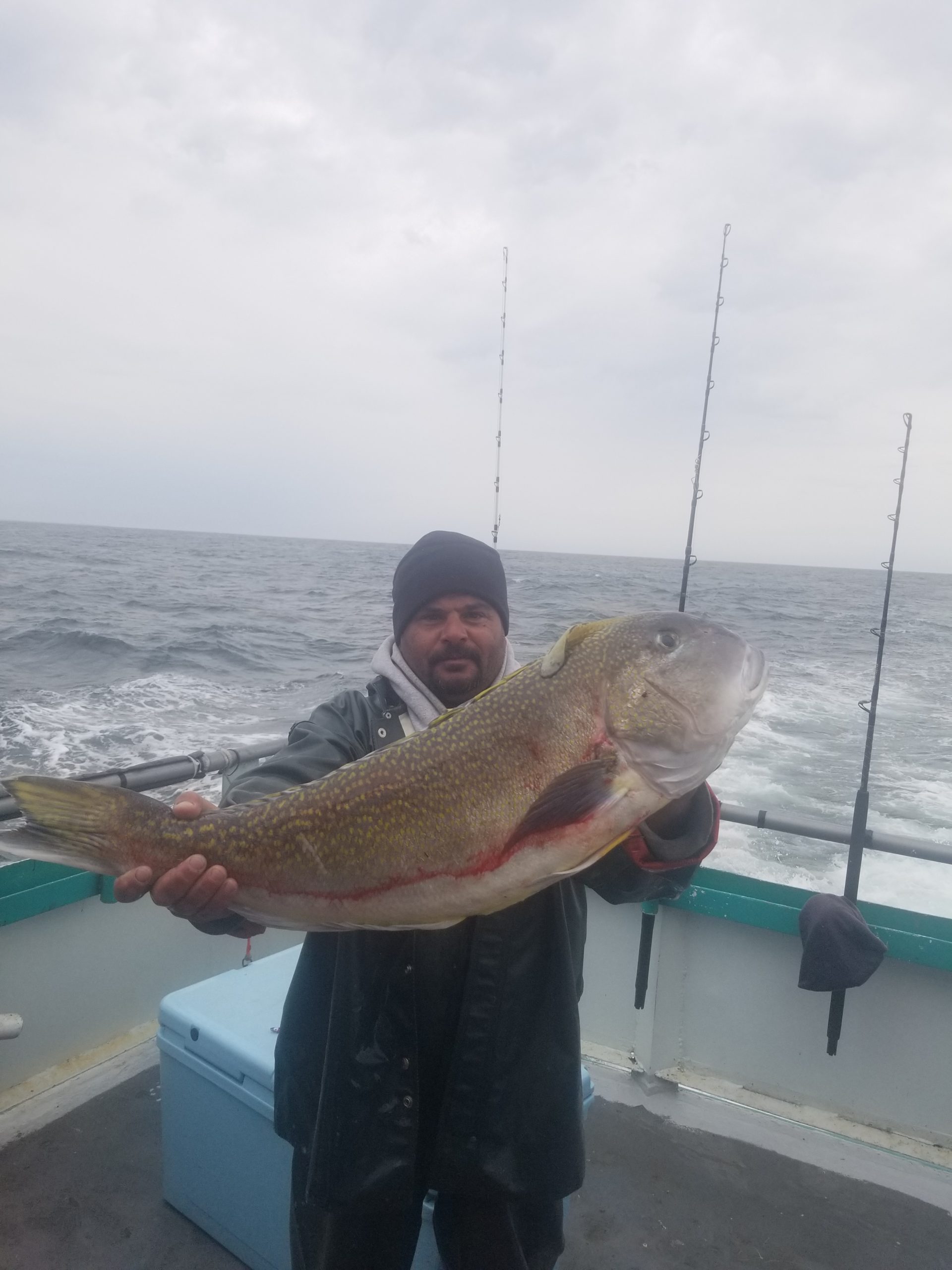 a man holding a fish in the water