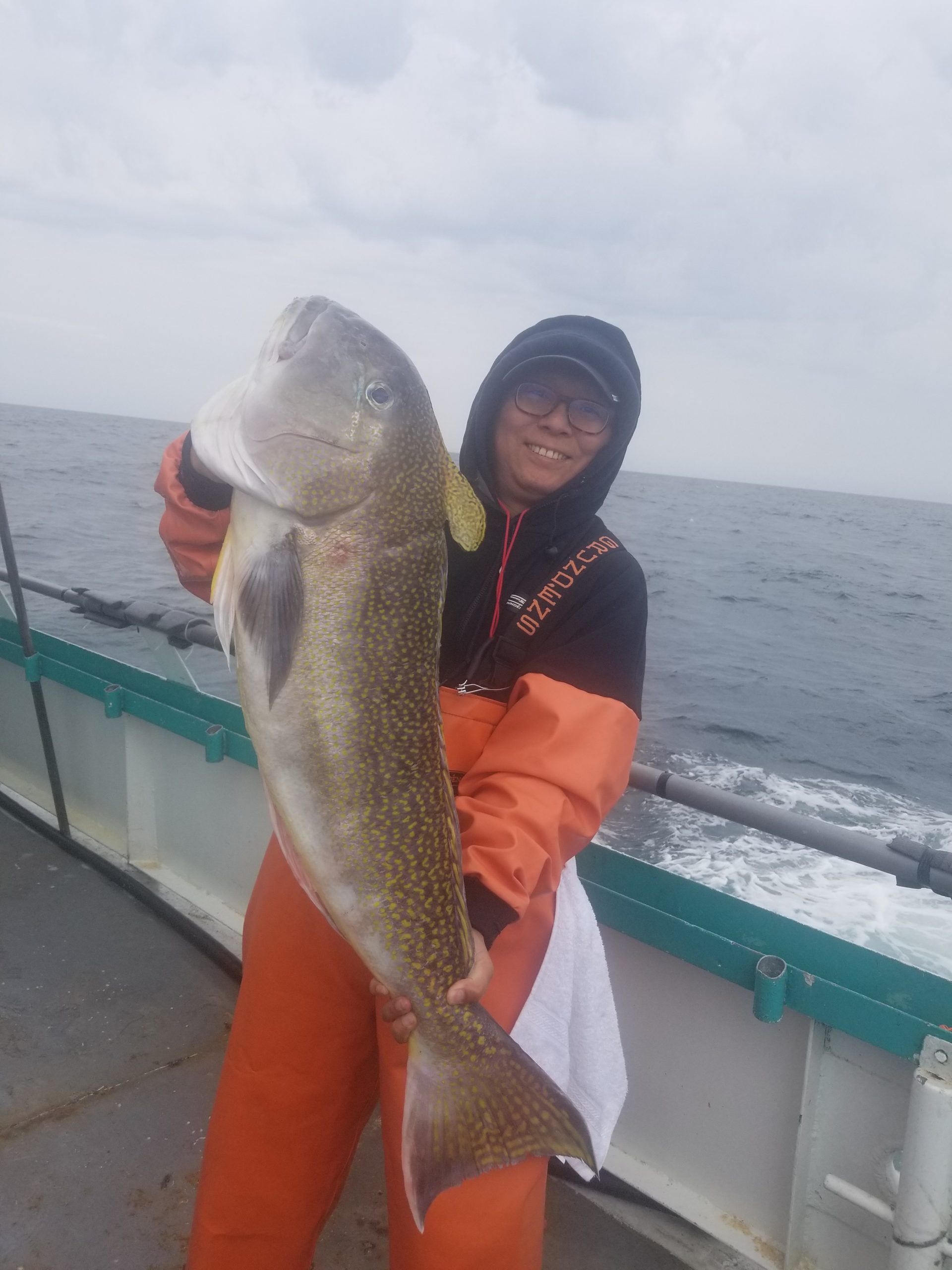 a person holding a fish in the water