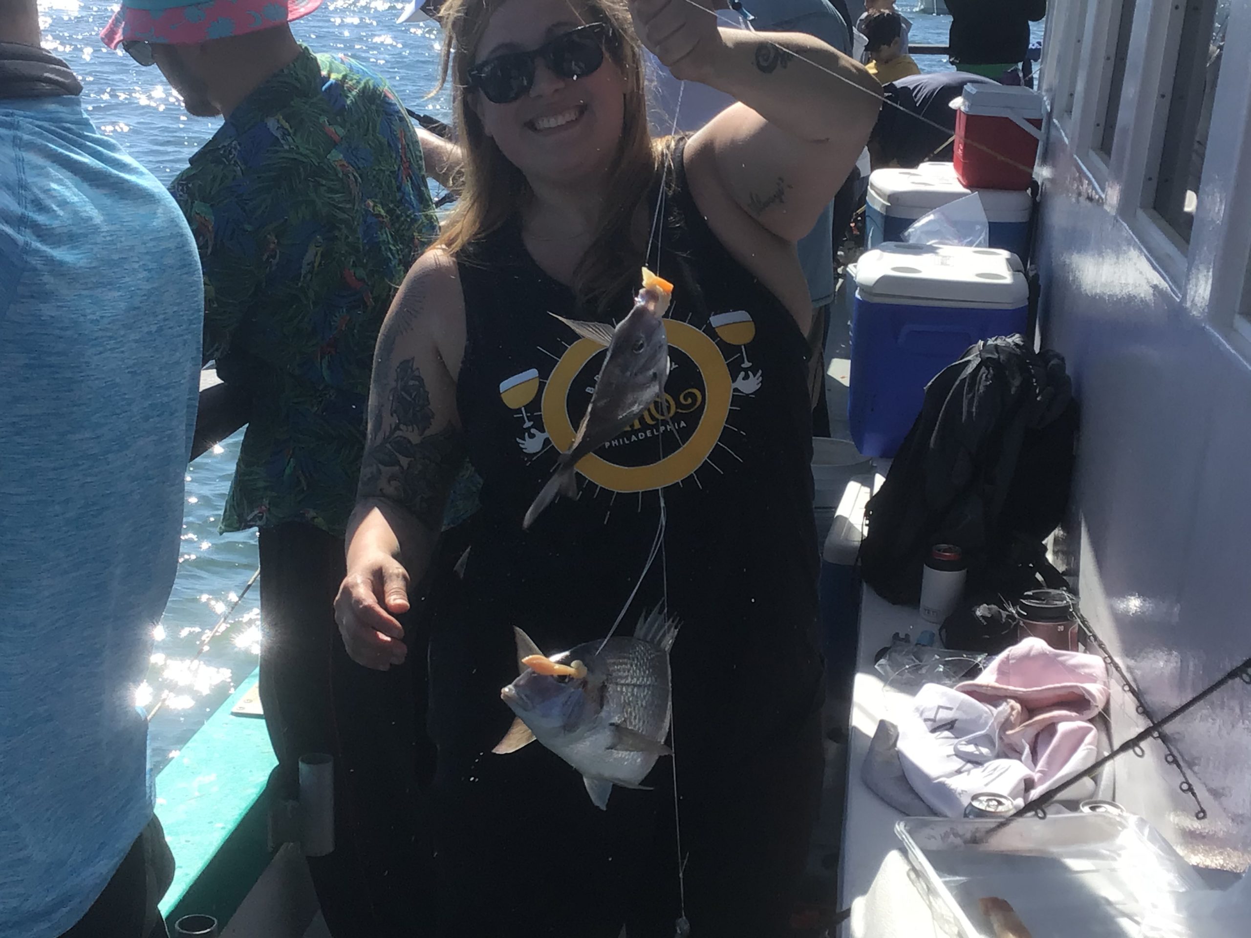 a person wearing a hat and sunglasses posing for the camera