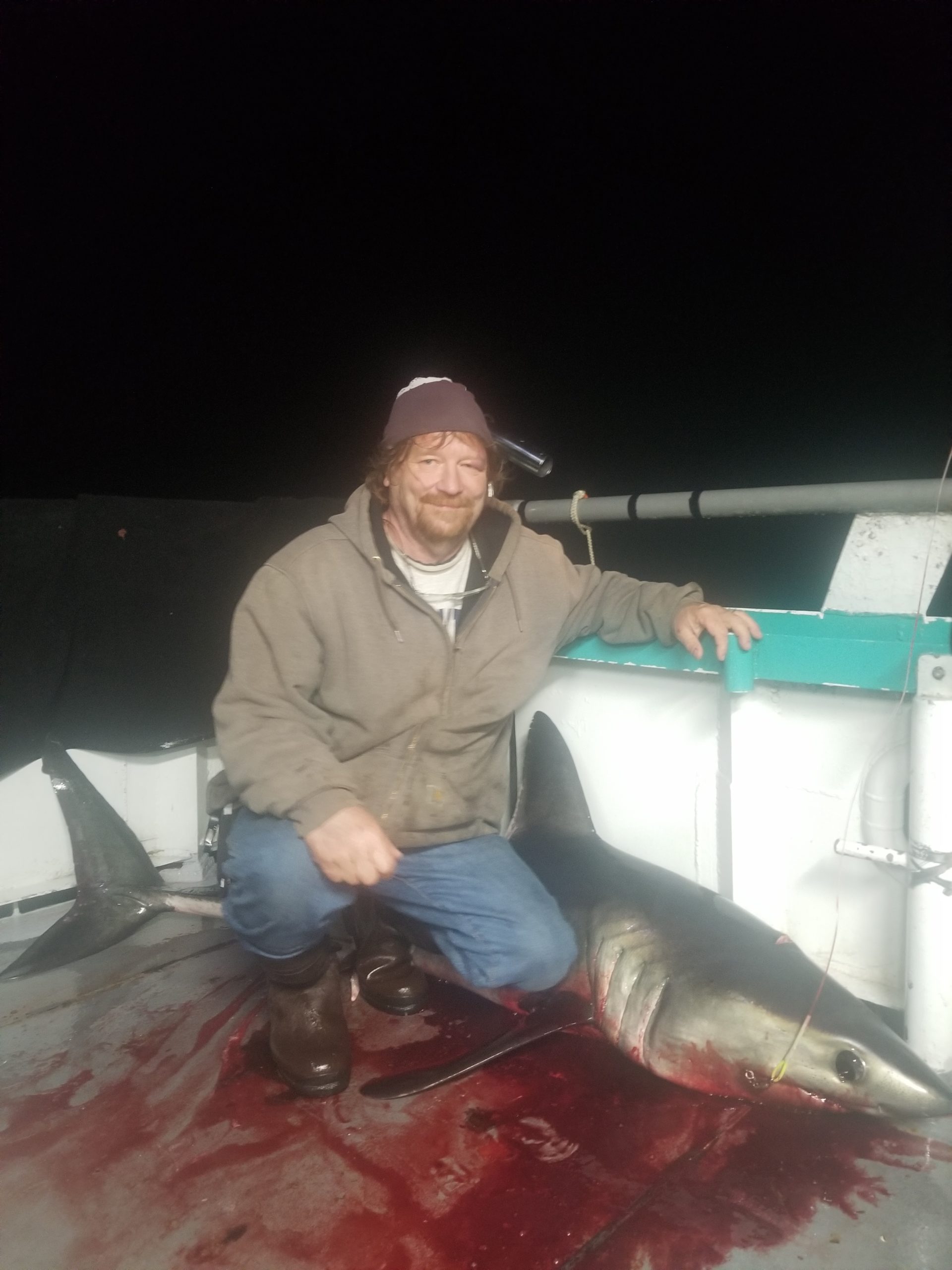 a person holding a fish