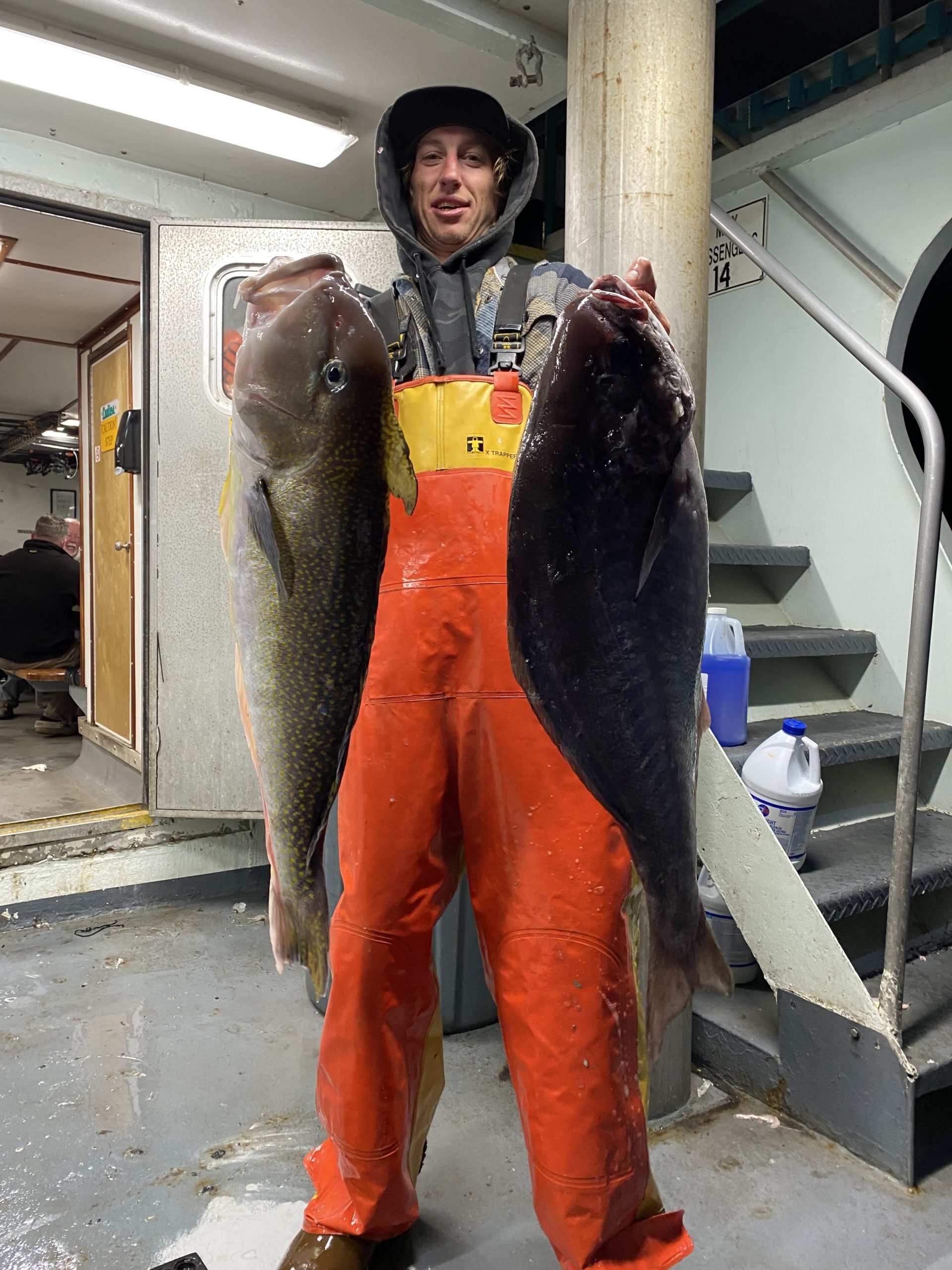 a person holding a fish