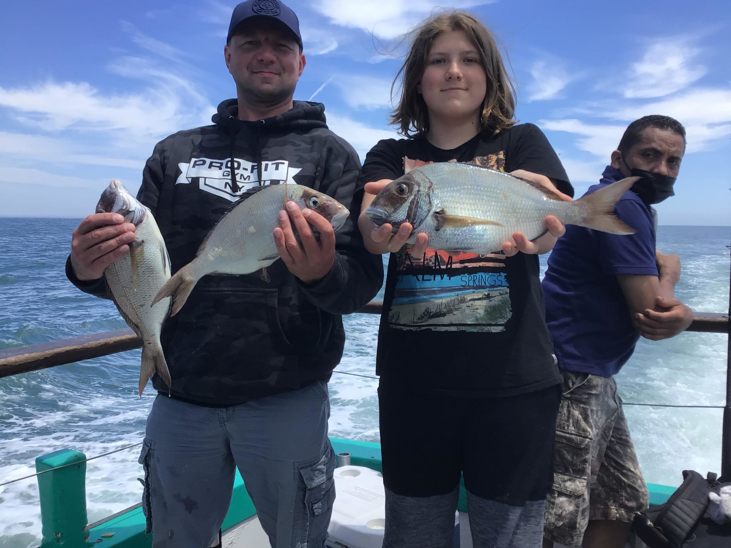 a person holding a fish in the water