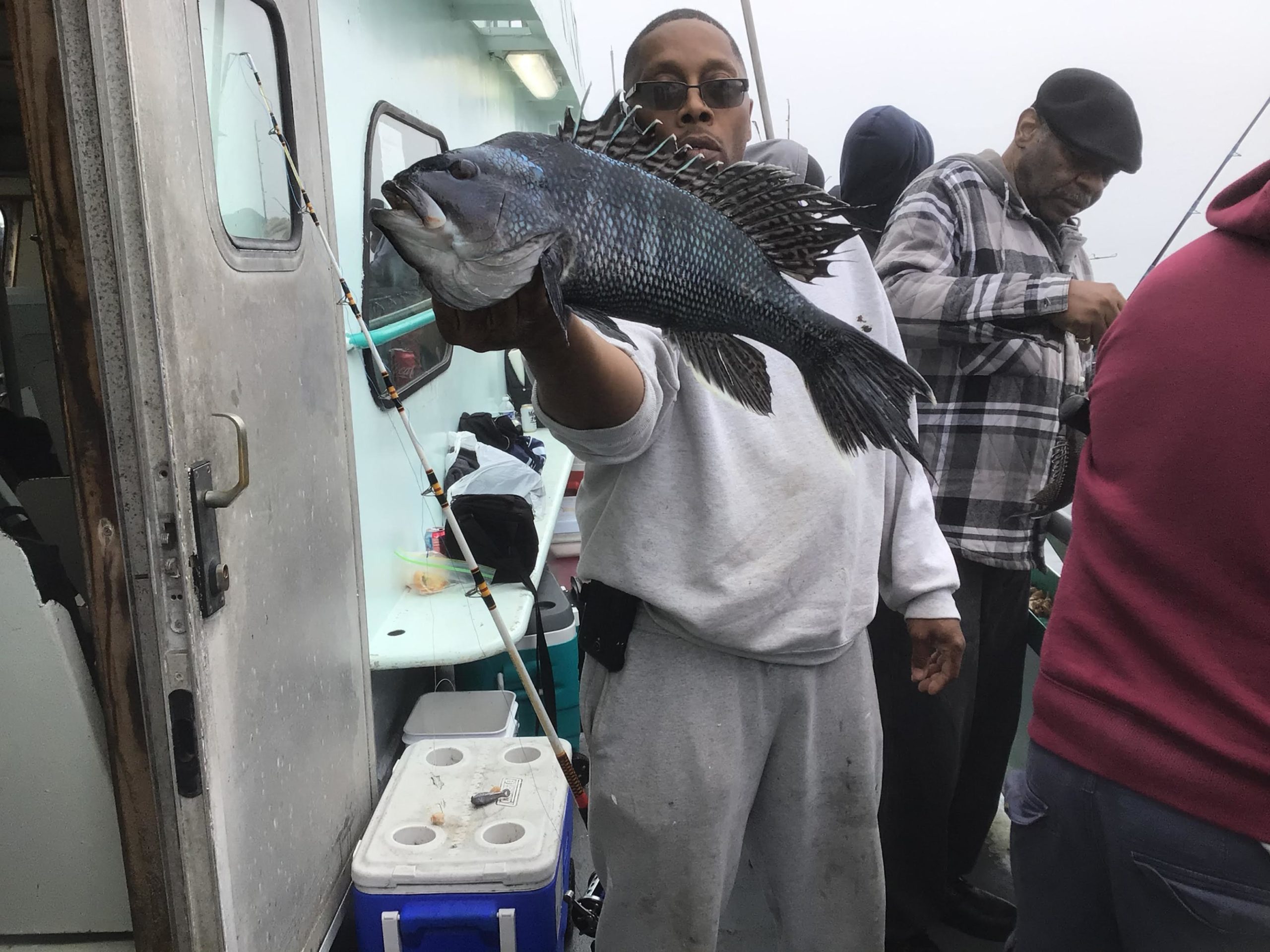 a person standing next to a suitcase