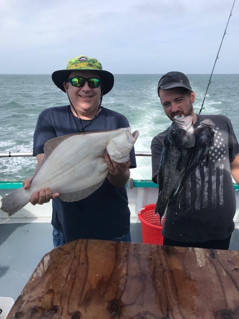 a person holding a fish in the water