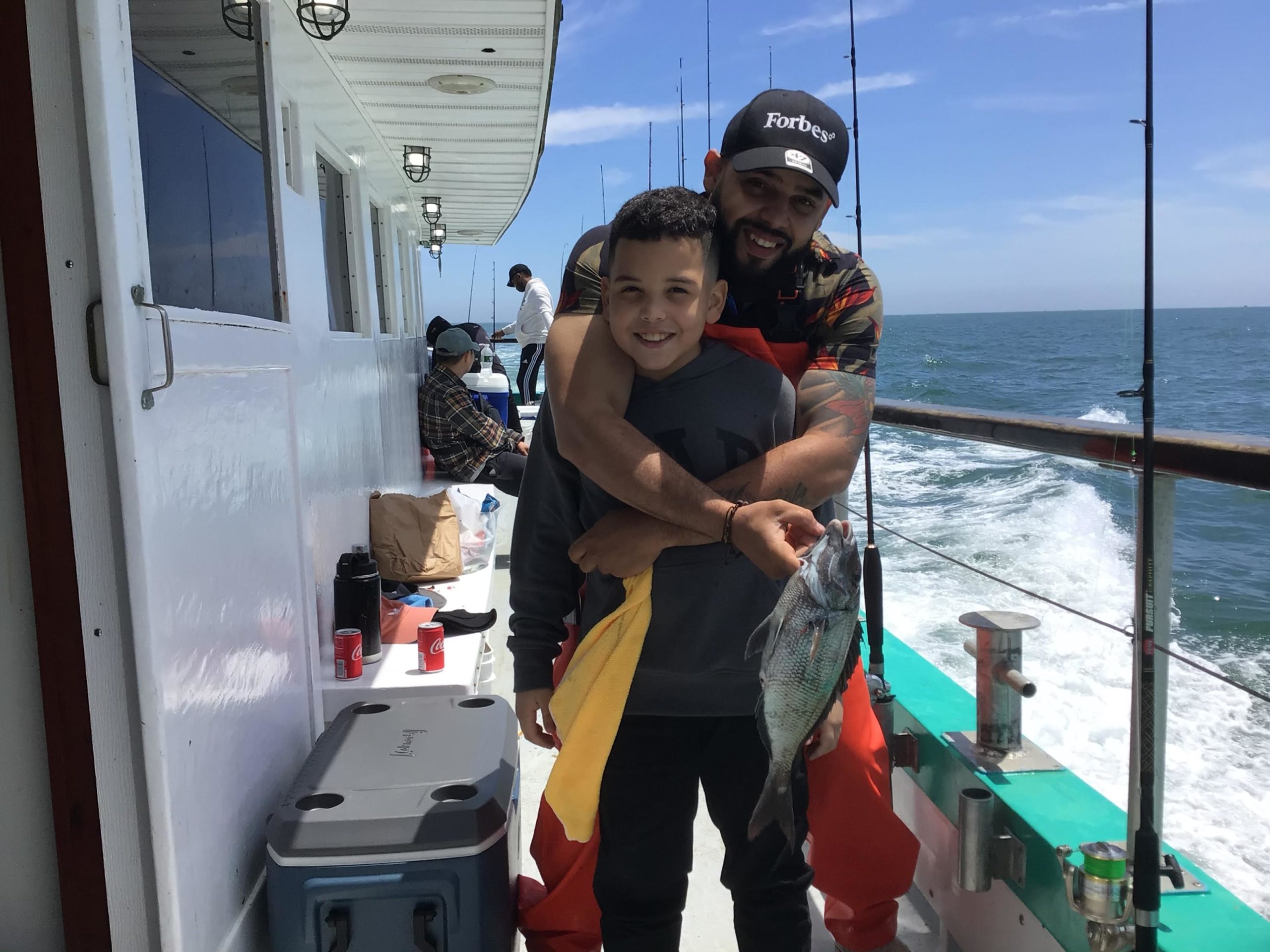 a person holding a fish in the water