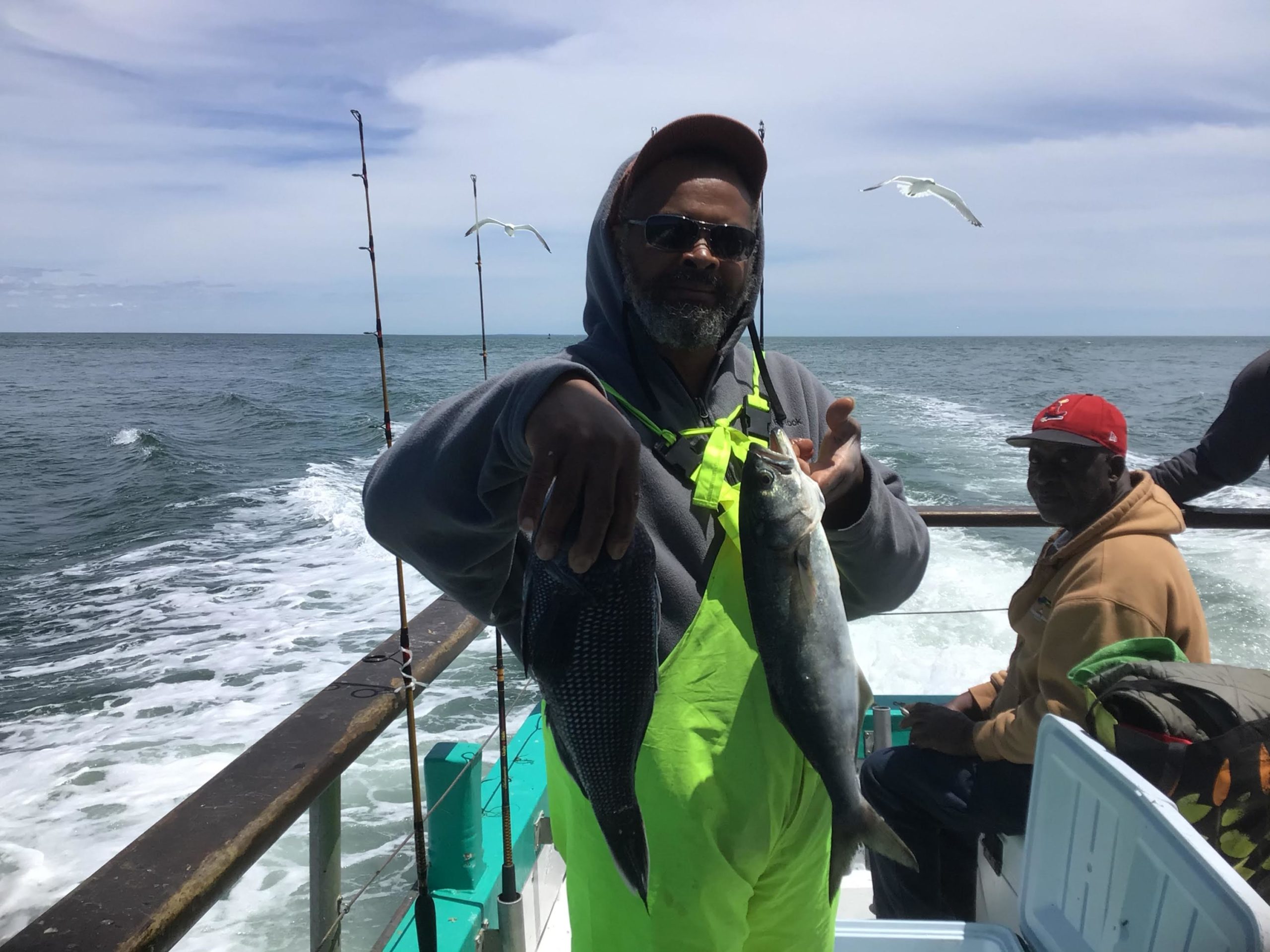 a person holding a fish in the water