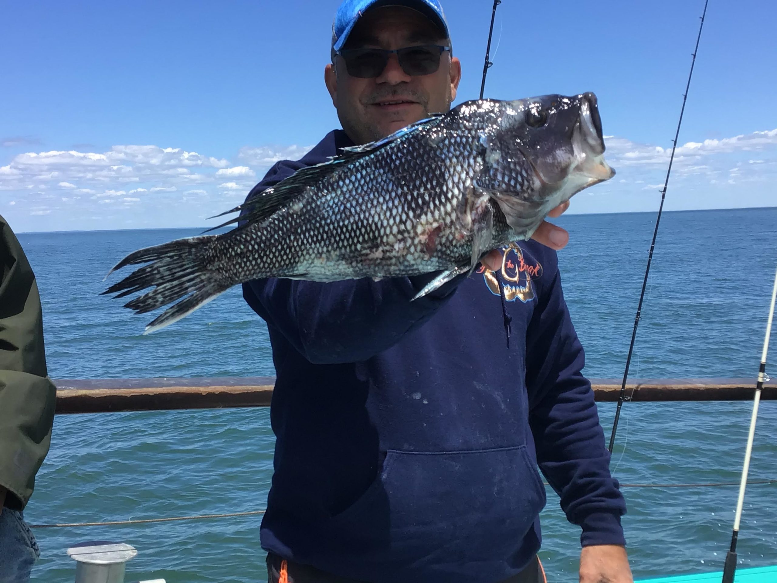 a person holding a fish in the water
