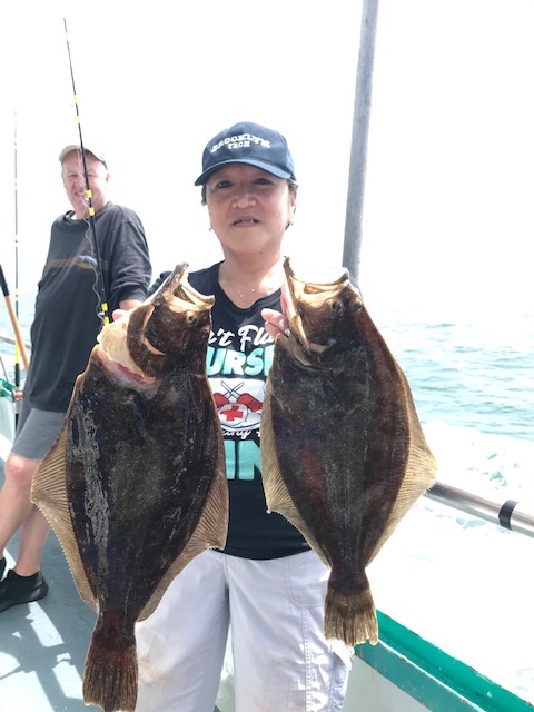 a person holding a fish