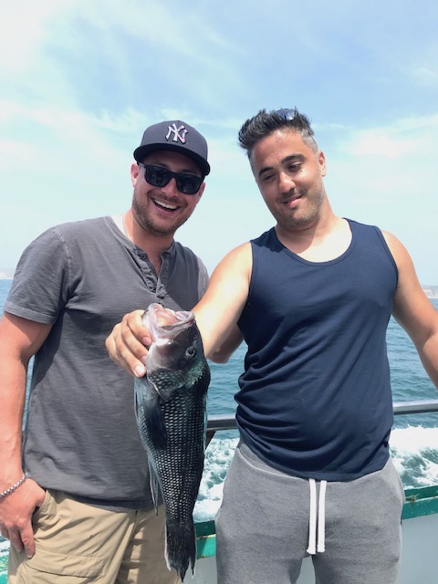 a person holding a fish