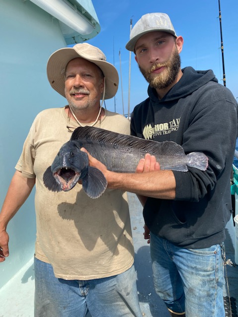 a person holding a fish