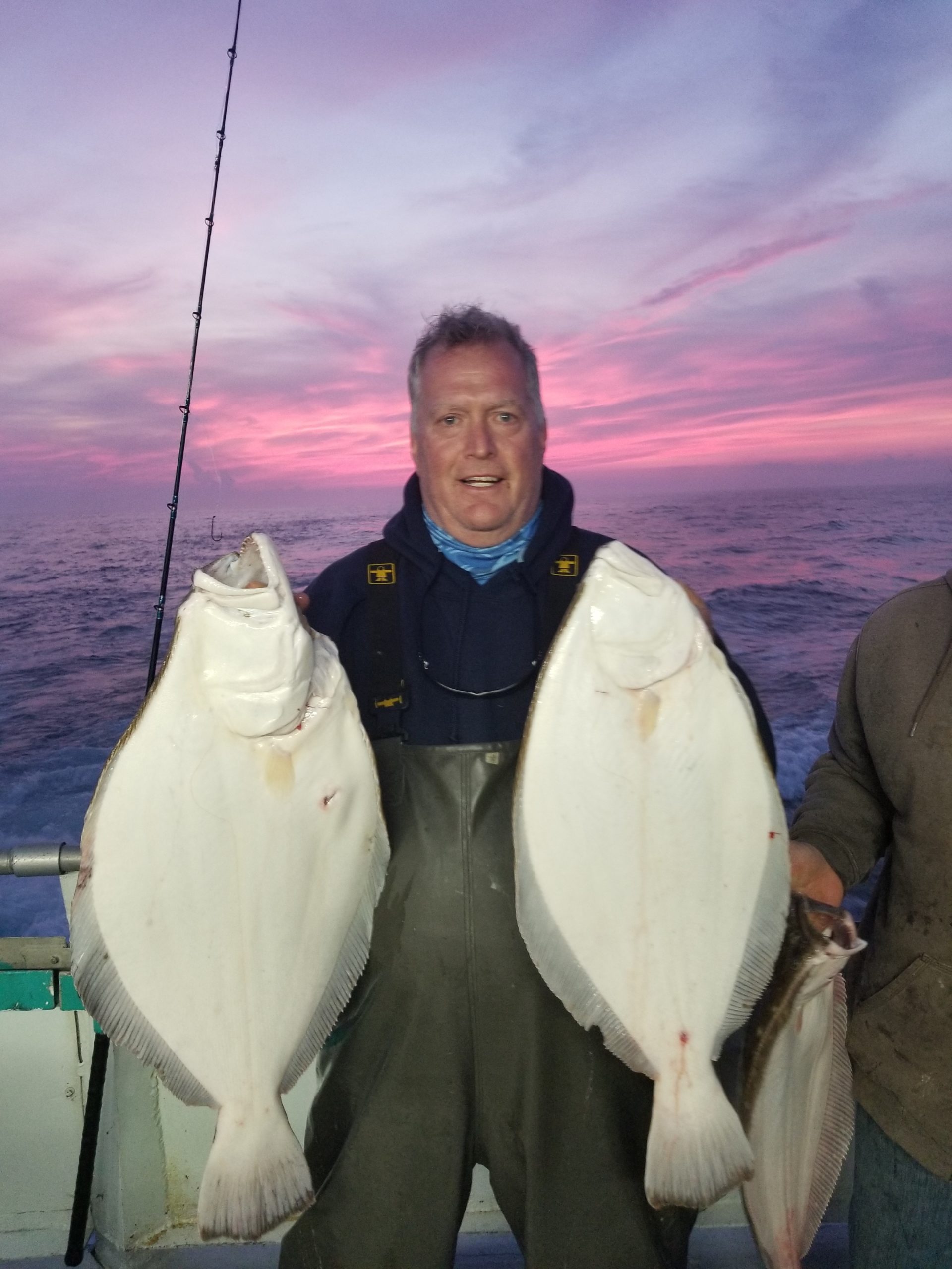 a man holding a fish