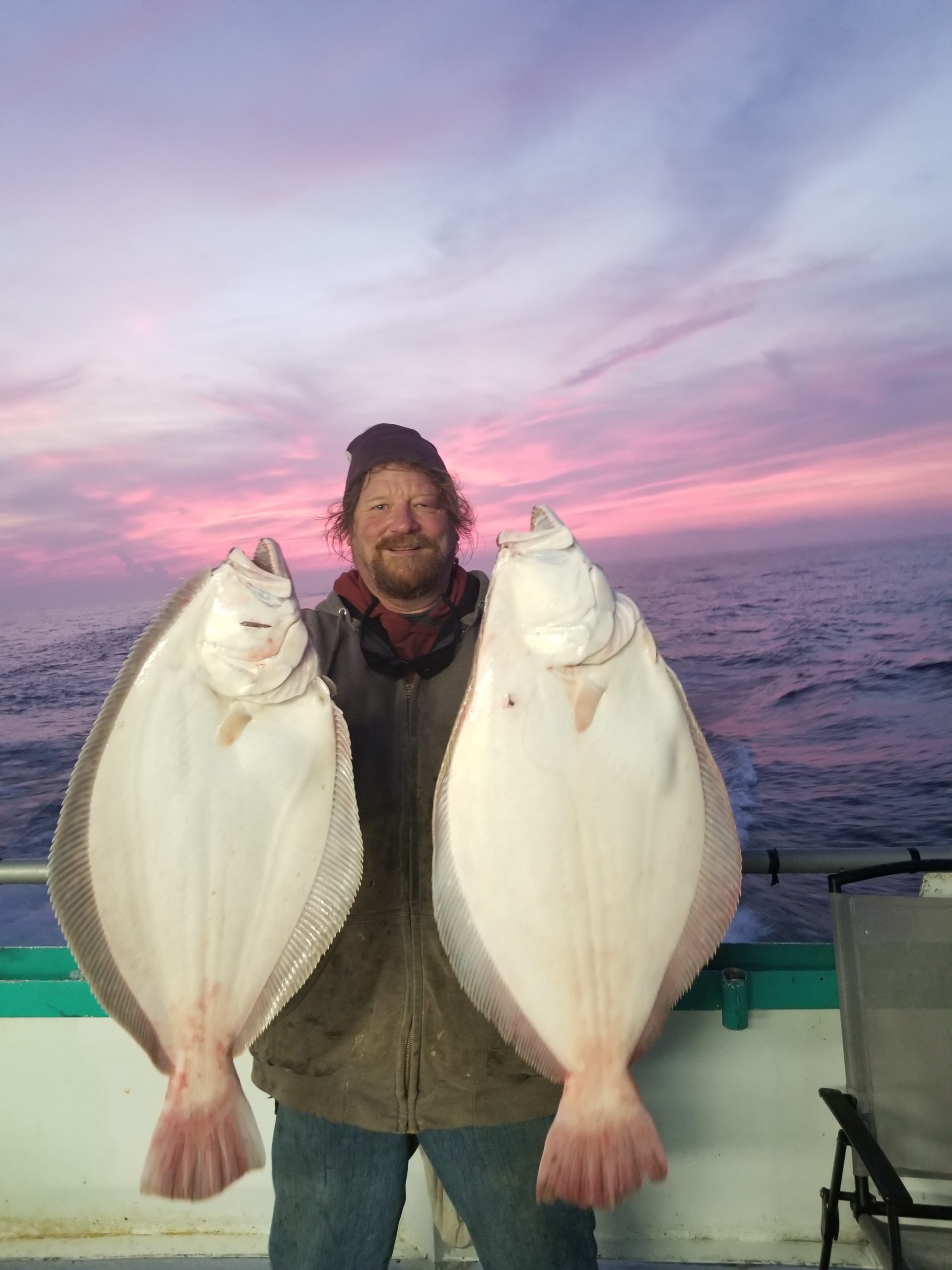 a man holding a fish