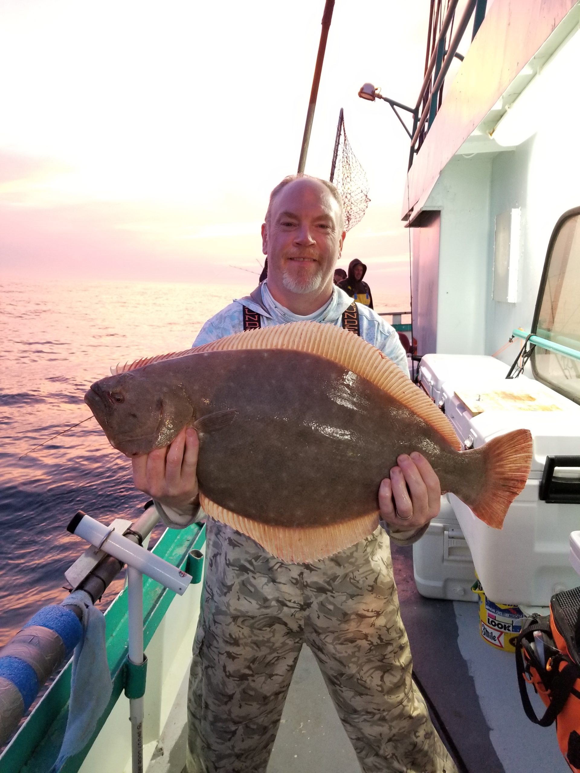 a man holding a fish