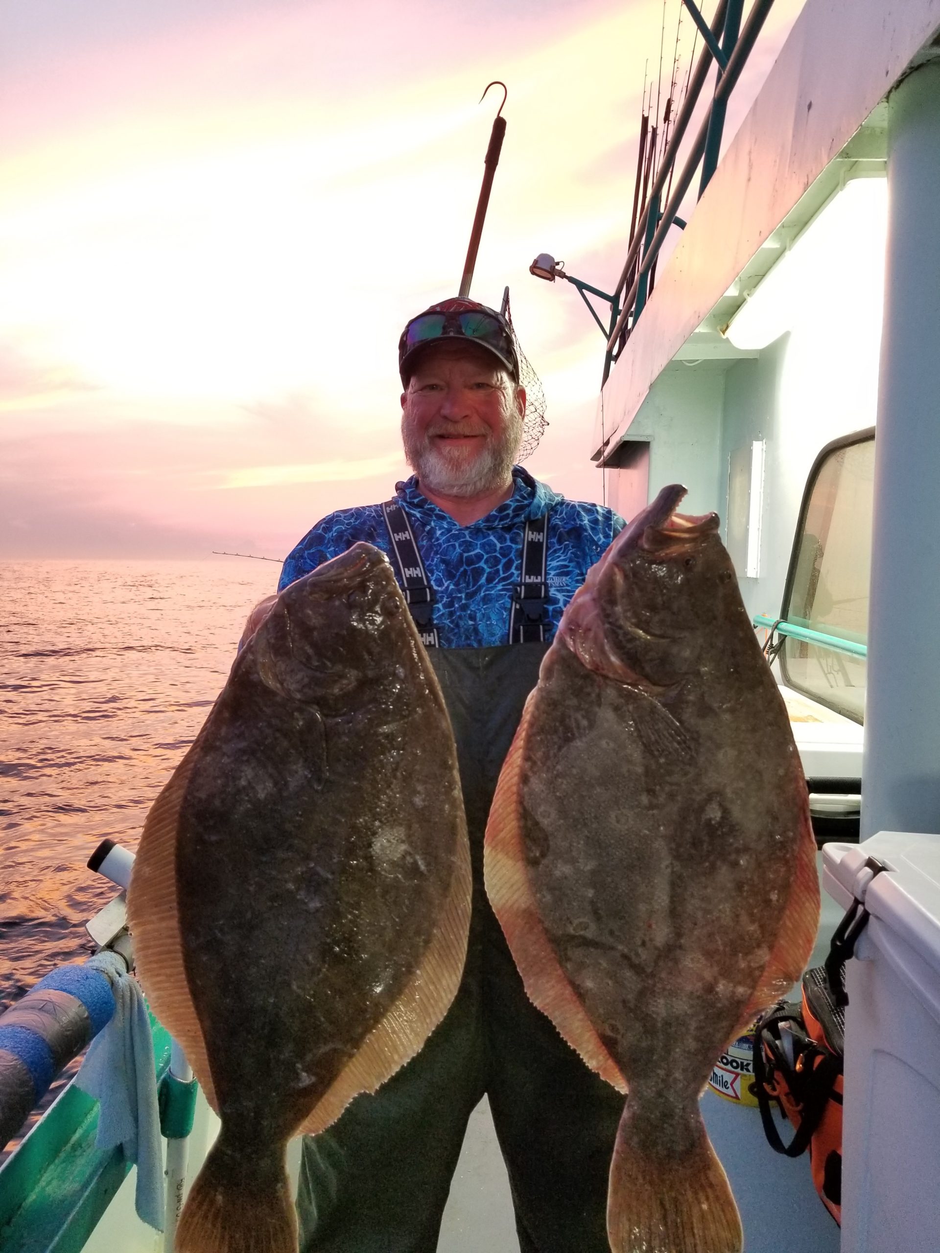 a man holding a fish