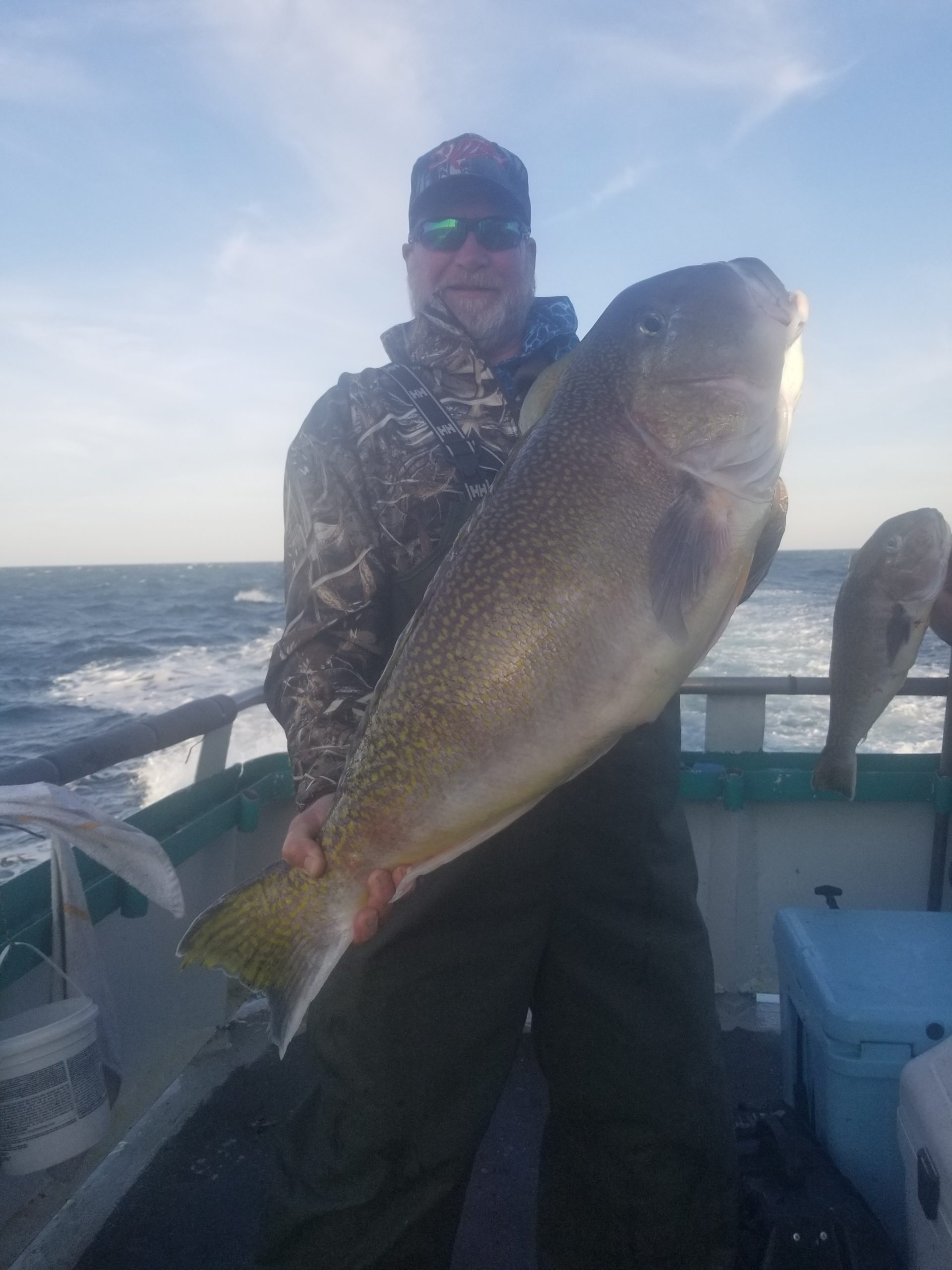 a man holding a fish