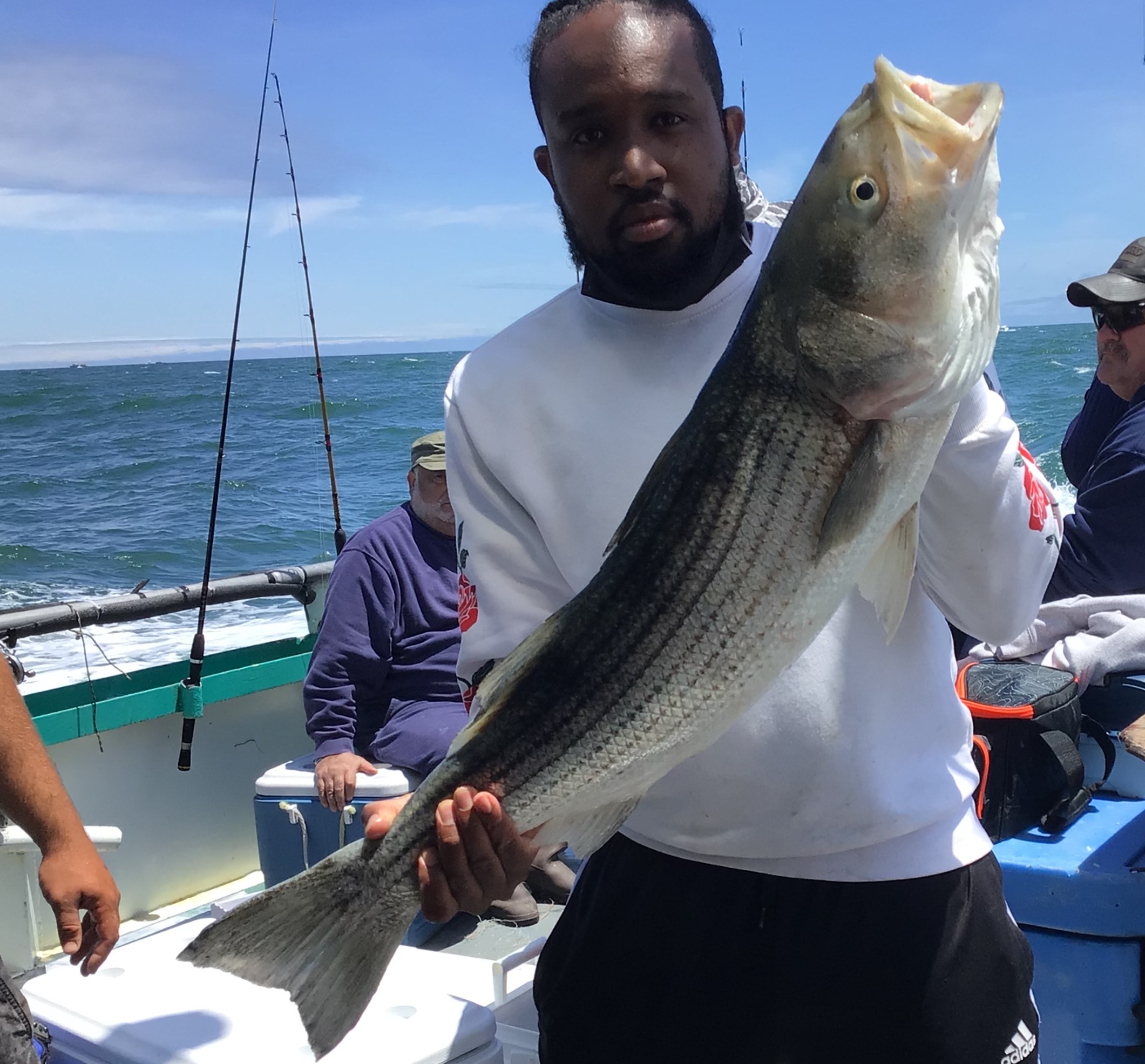 a person holding a fish in the water
