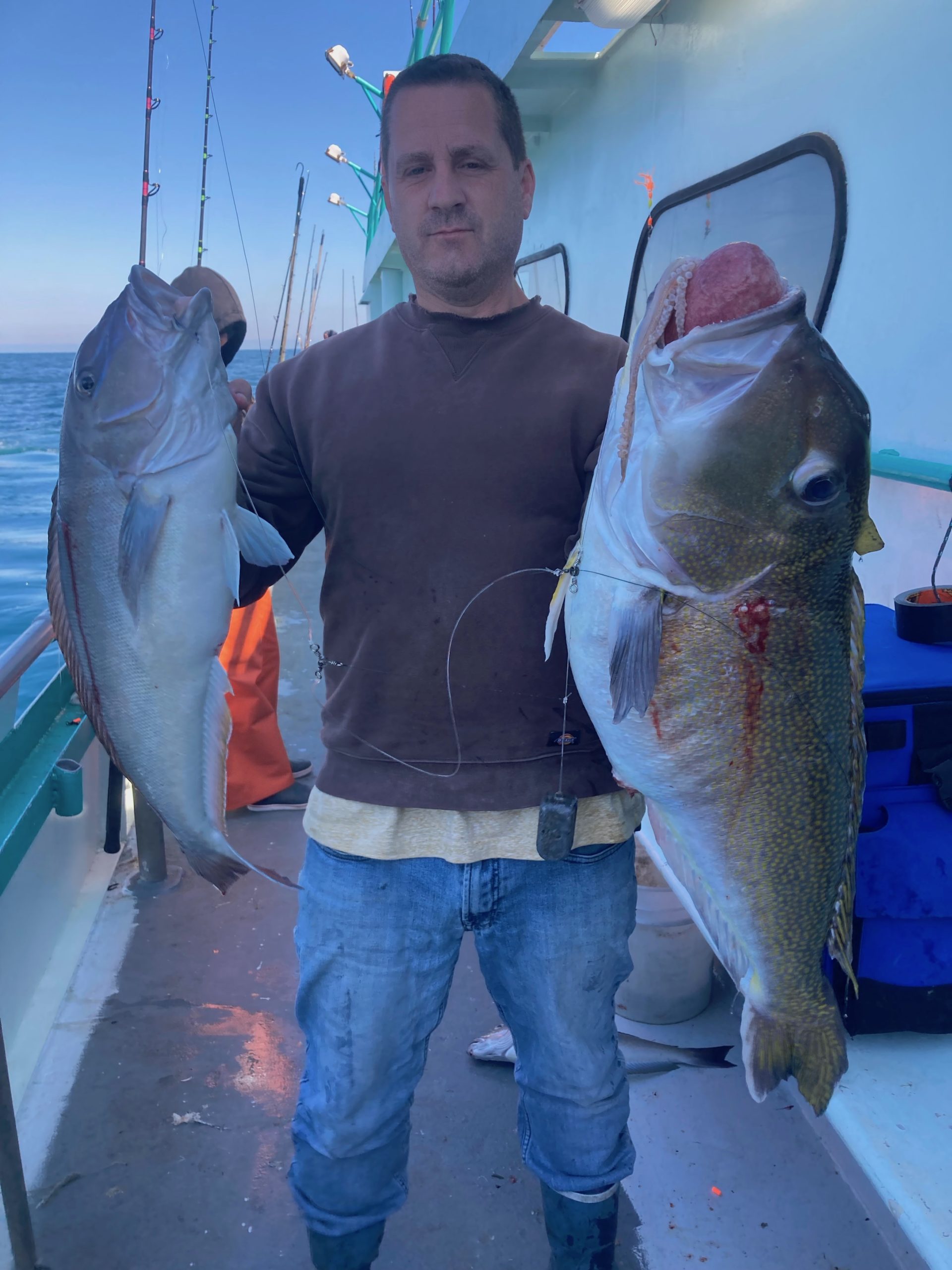 a person holding a fish