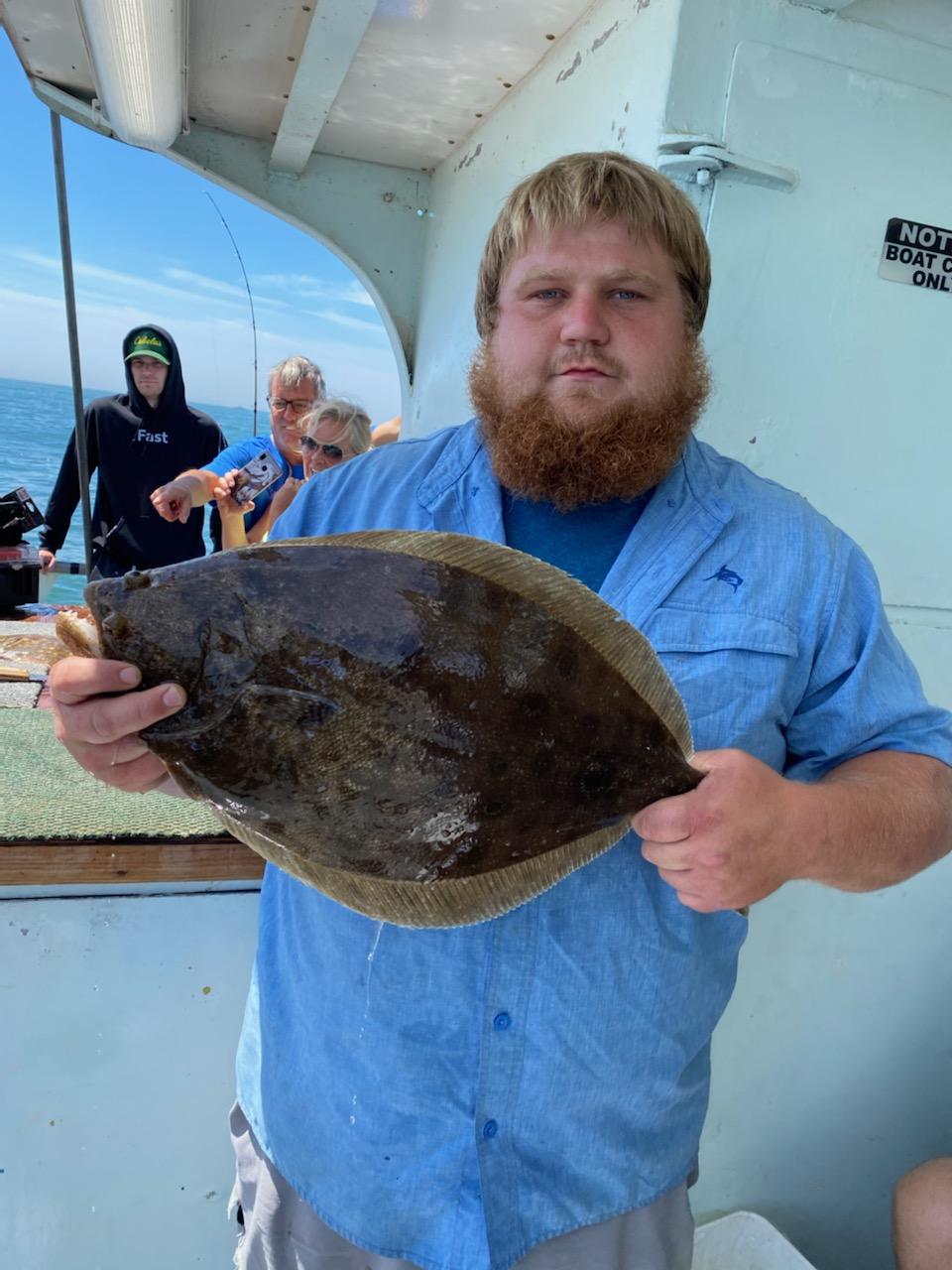a man holding a fish
