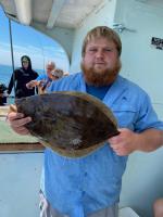 a man holding a fish