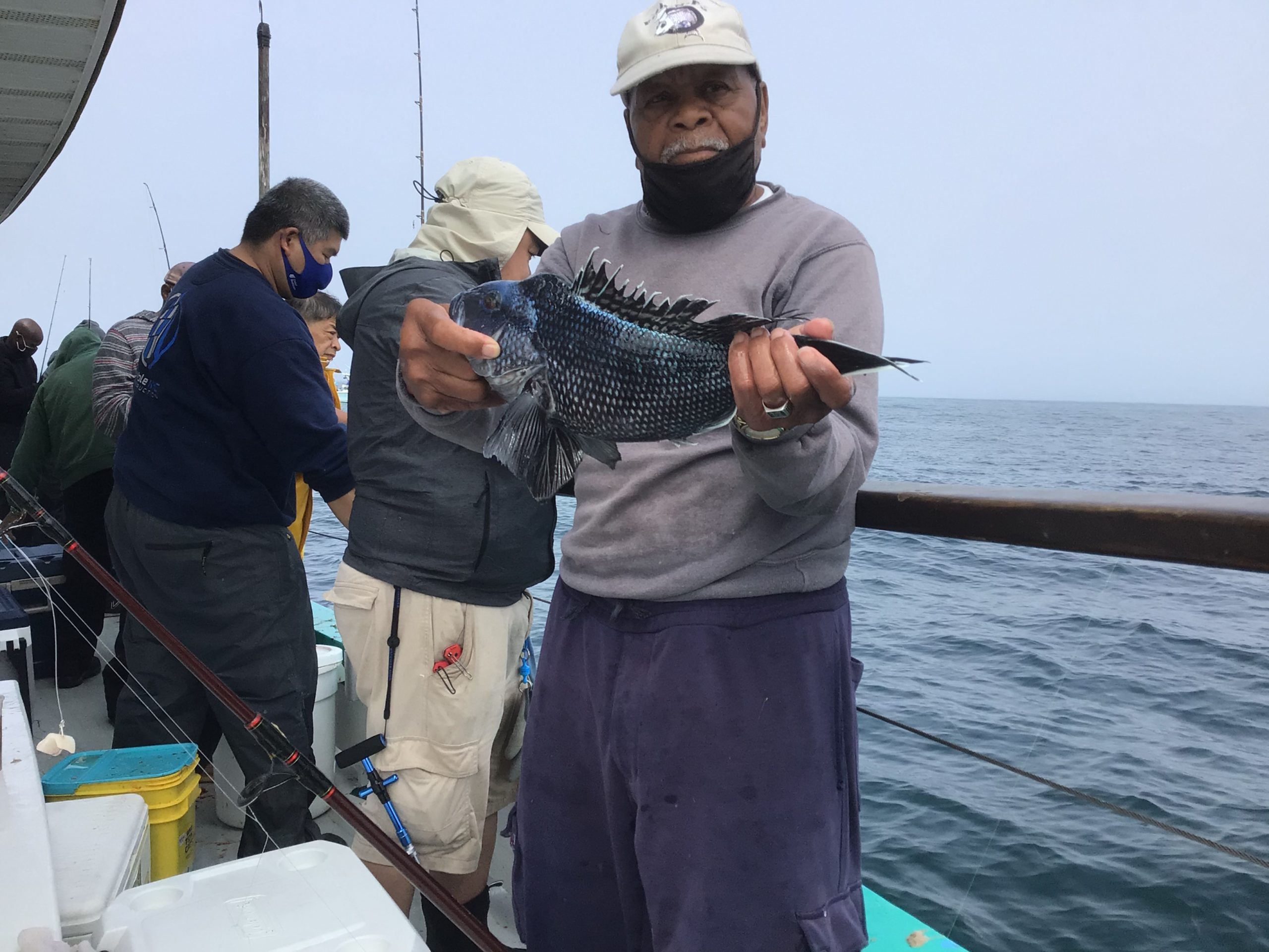 a person holding a fish in the water